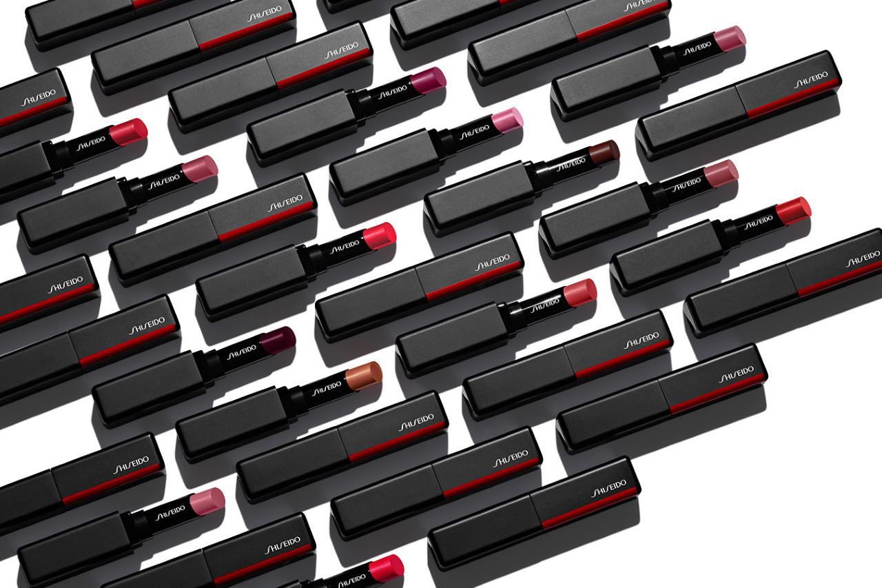 KMA stylist Rachel Haas designs set for photo of many lipsticks arranged in lines on white background with tubes for Shiseido