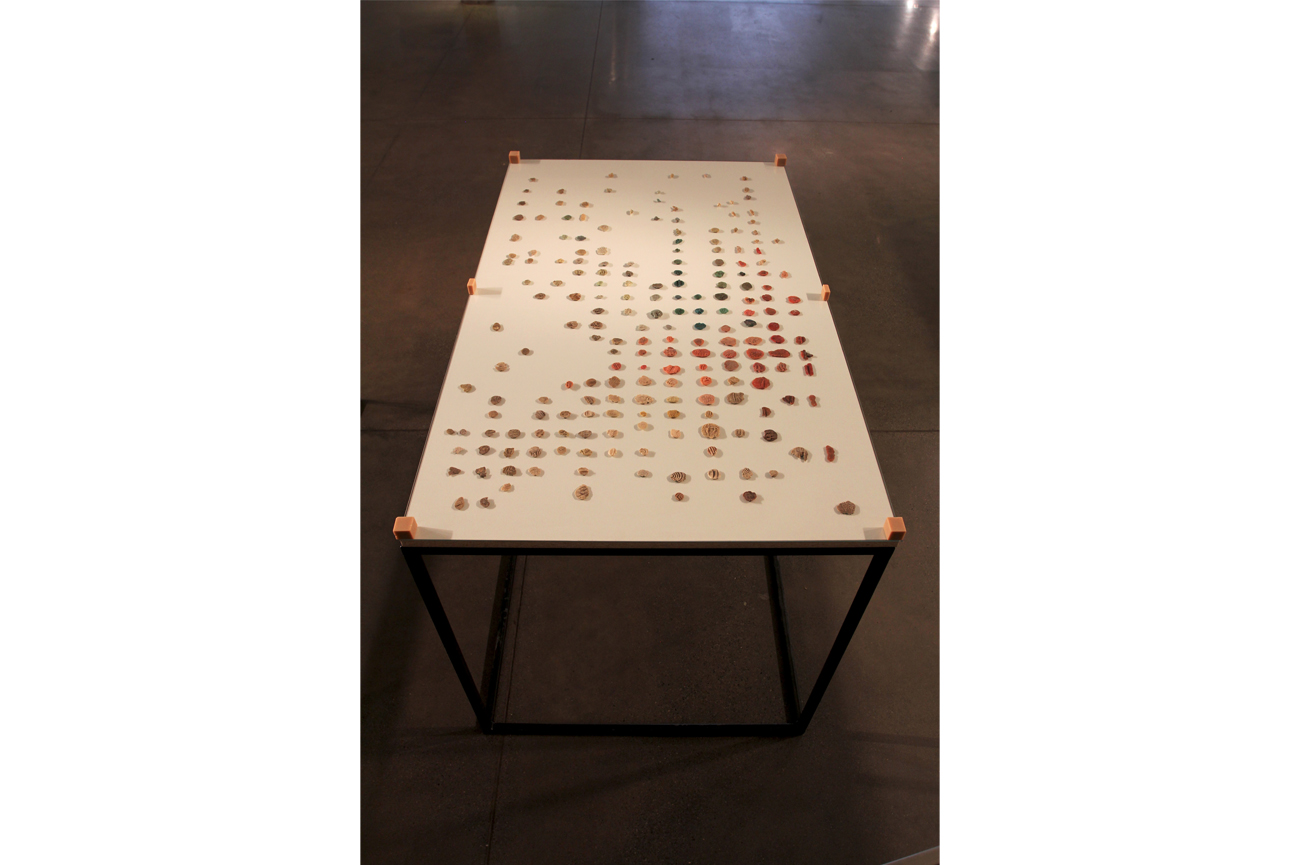 Sebastián PreeceChicles, andar por Curitiba, 2011Three black iron structures, grey melamine wood base and colourless glass cover containing chewing gum77 x 75 x 125 cm c/u