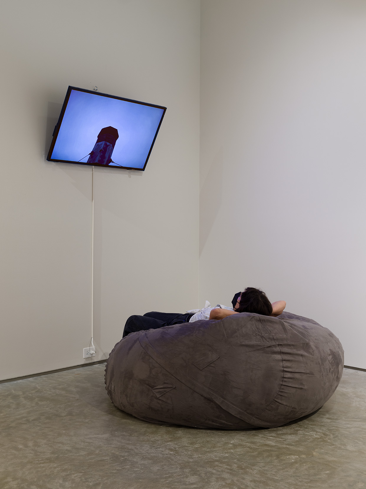 Installation view of Vanessa Renwick's "Layover", 2014, HD video, 6 min. Image by Etienne Frossard.