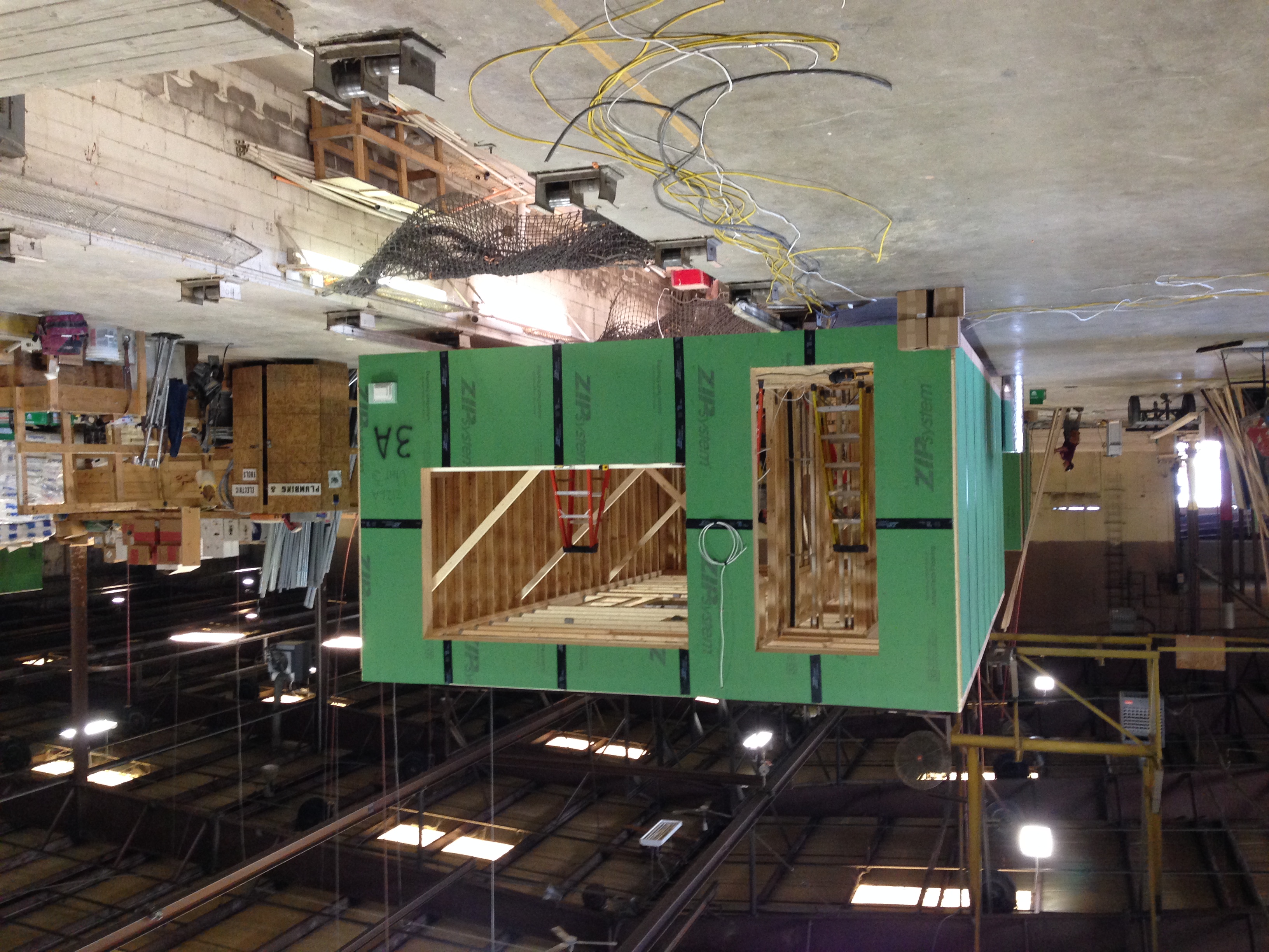 The townhomes were factory-built modular construction by Beracah Homes in Delaware. The 20-foot-wide boxes were shipped on flatbed trailers and craned into the site.