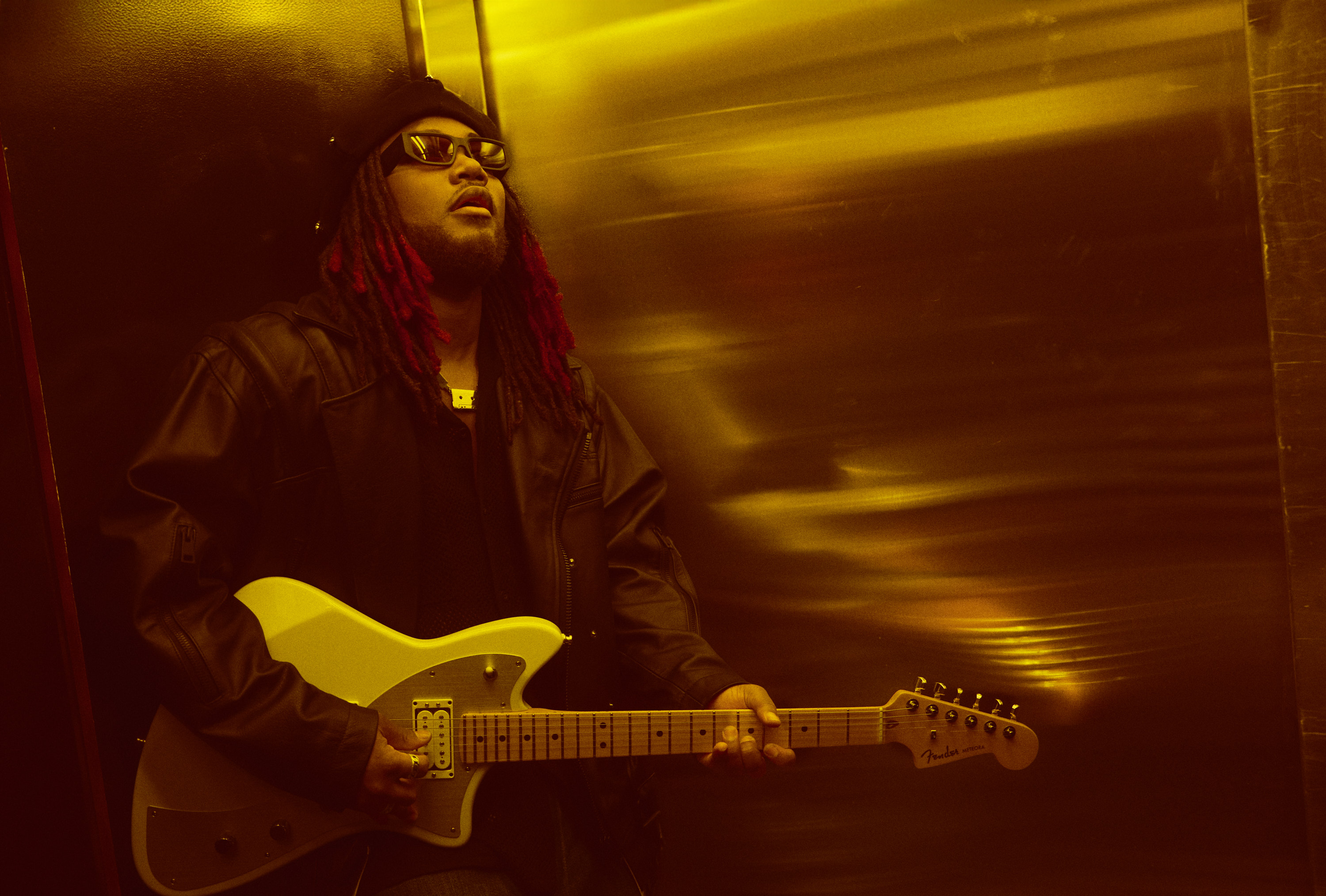 Magazine cover shoot with Leon Thomas photographed with guitar for Billboard cover shoot by Austin Hargrave