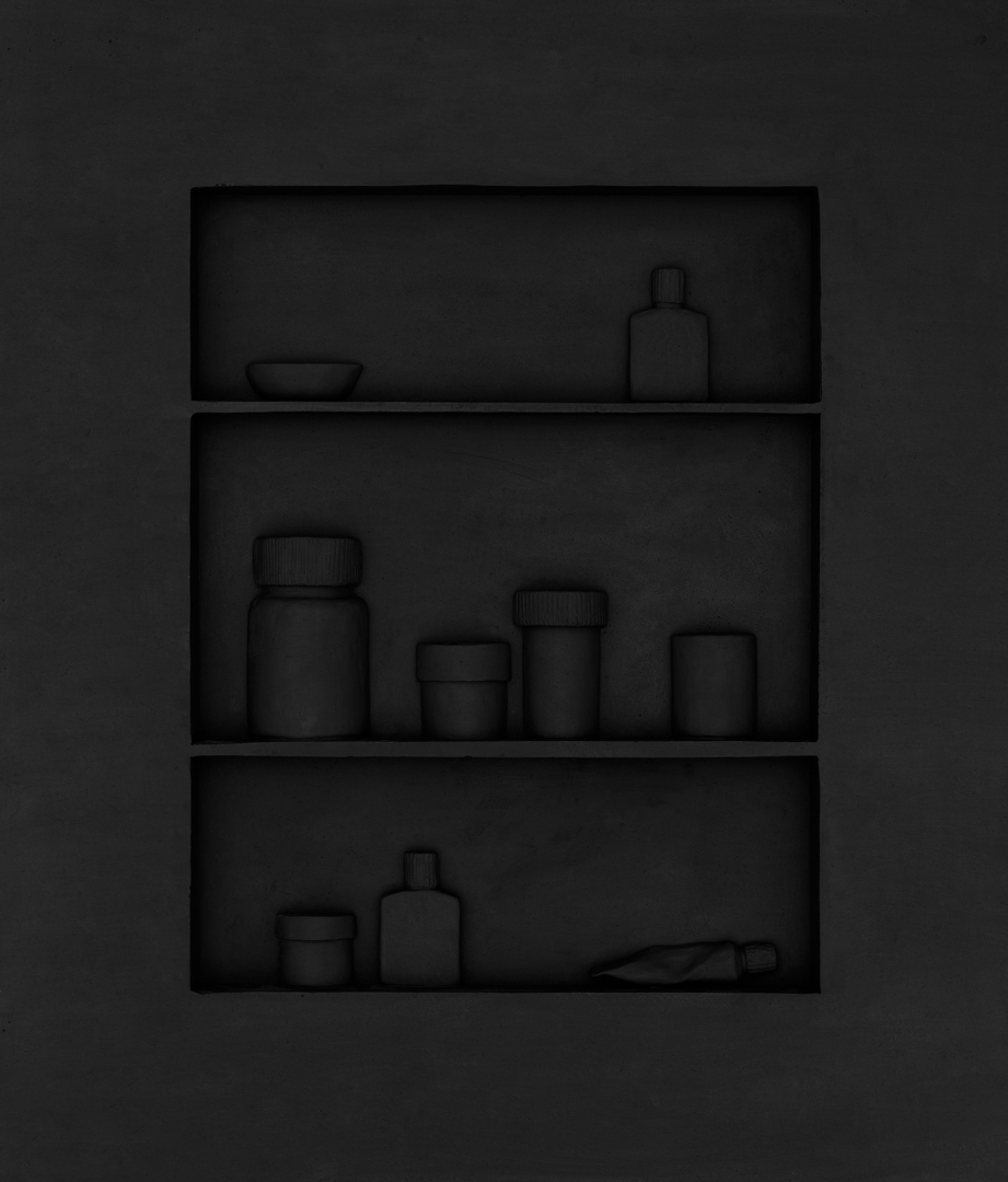 a black bas-relief casting of medicine cabinet 