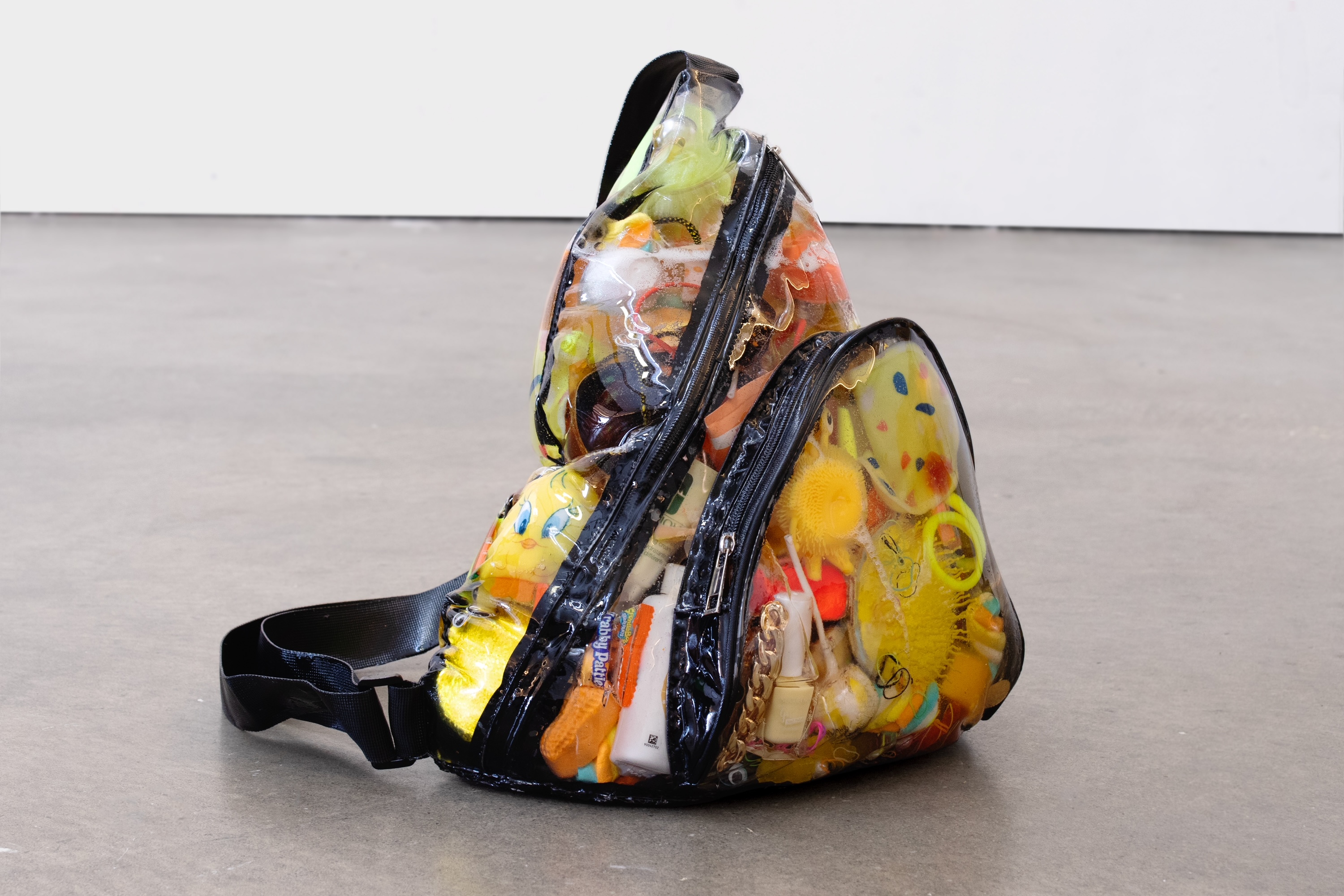 Contraband Bag_4, 2023, clear bag, resin, contraband objects at the Columbia Secure Center for Girls, 13 x 14 x 14 inches (33 x 35.6 x 35.6 cm)