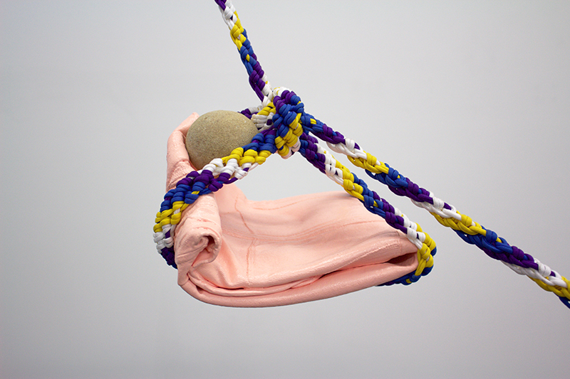 detail of When I look at you, 2016. Acrylic paint on fabric, rock, ropes, single channel video projection, hardware, print on paper, and projector. Variable Dimensions