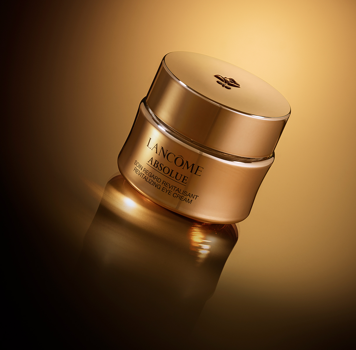 KMA photographer Isabelle Bonjean shoots sideways photo of Lancome revitalizing eye cream bottle with lid on