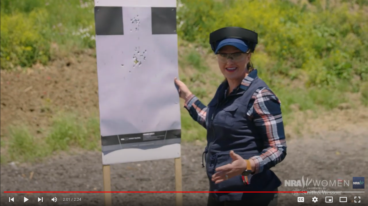 "Love at First Shot" host Julie Golob showing the results of her drill designed to target the head of body of a target