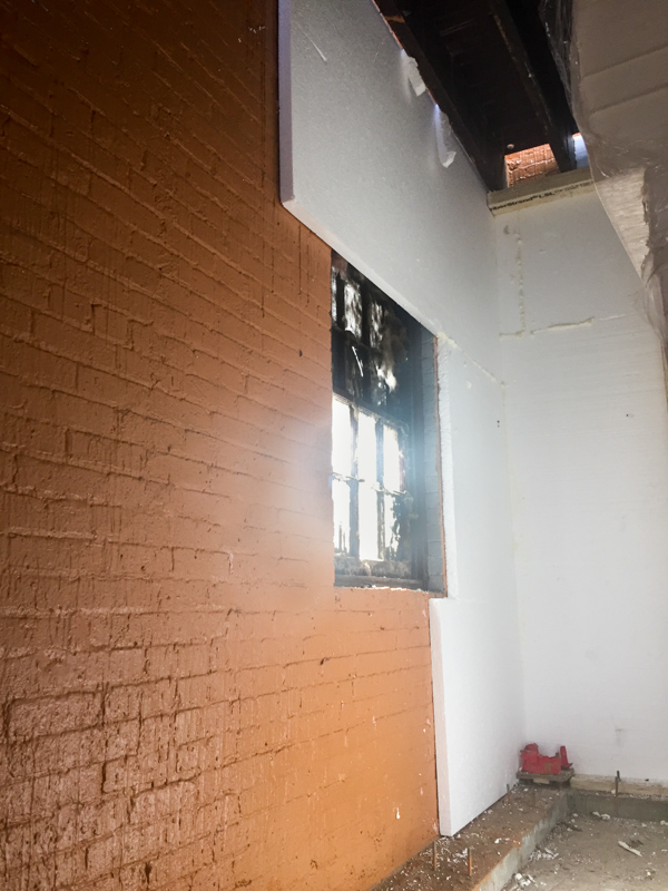 Insulating and air sealing at interior during construction