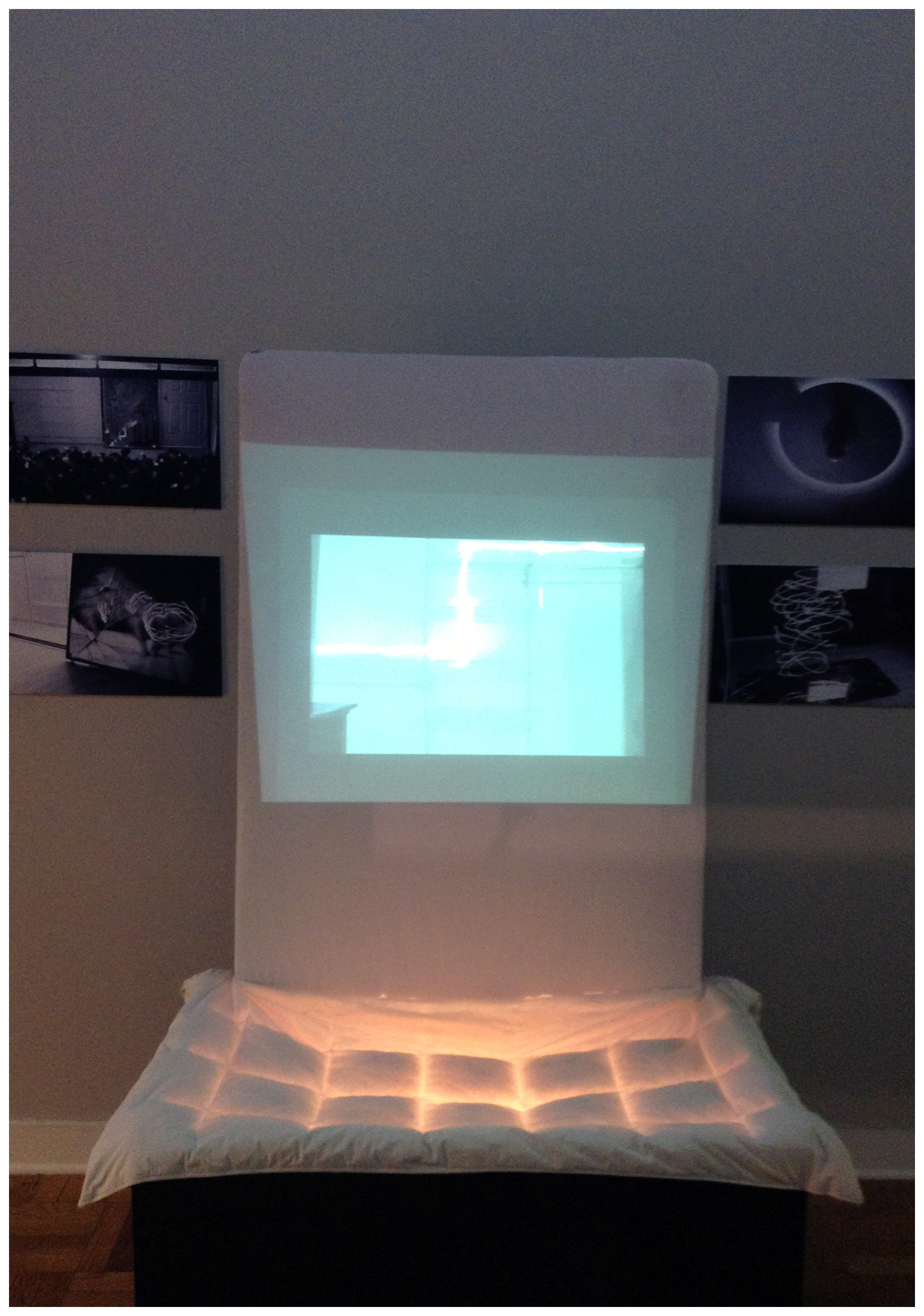 Leaving the Nest (installation view), 2013Projection, luster inkjet paper, foam core, bed board/sheet, childhood blanket, work light, glossy paint, wood86 x 72 x 36 in.218.44 x 182.88 x 91.44 cm