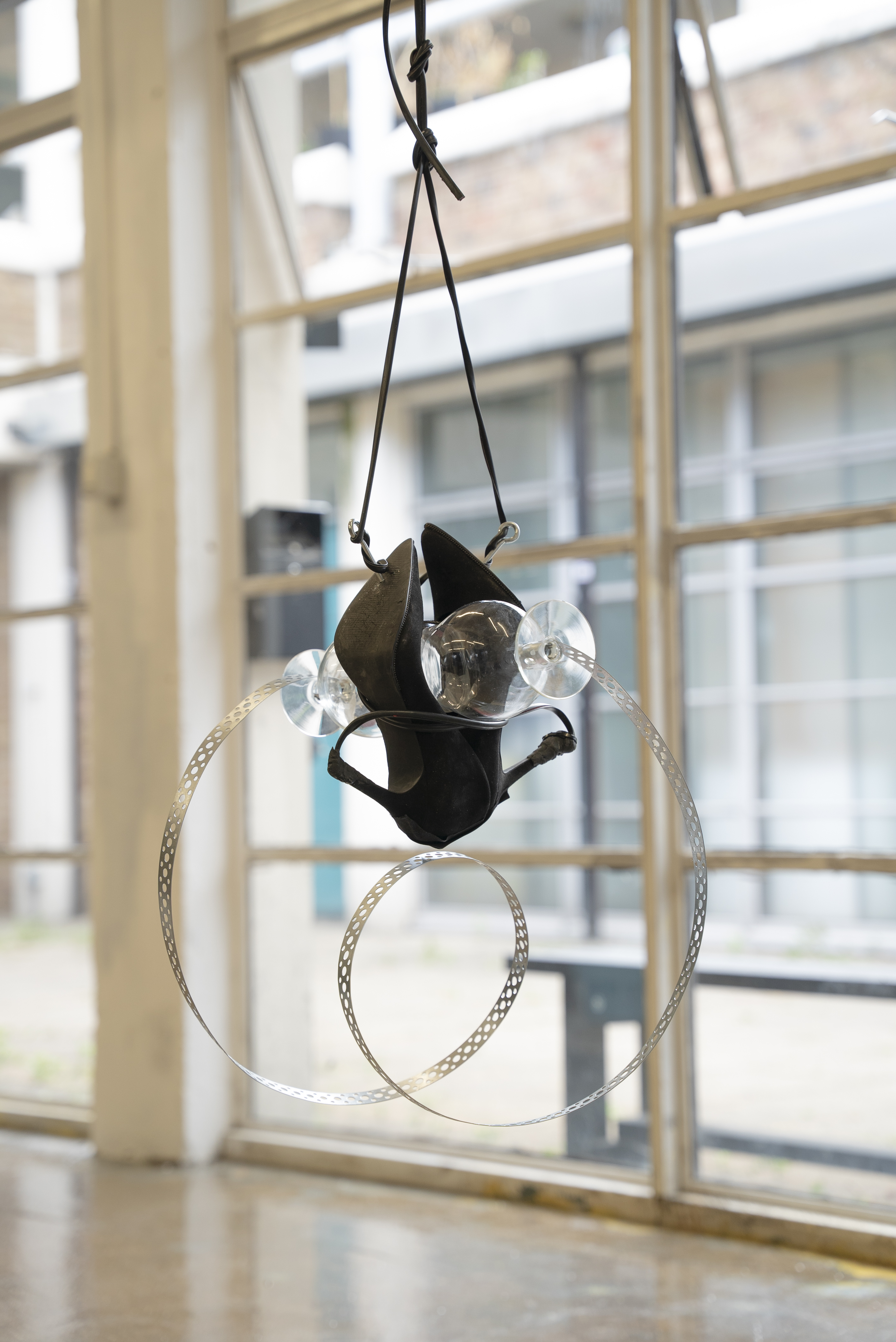 Ring III, 2022, High heels, Wine glasses, Steel reinforcement band, Electrical cable, Hooks, Epoxy putty, Tape.