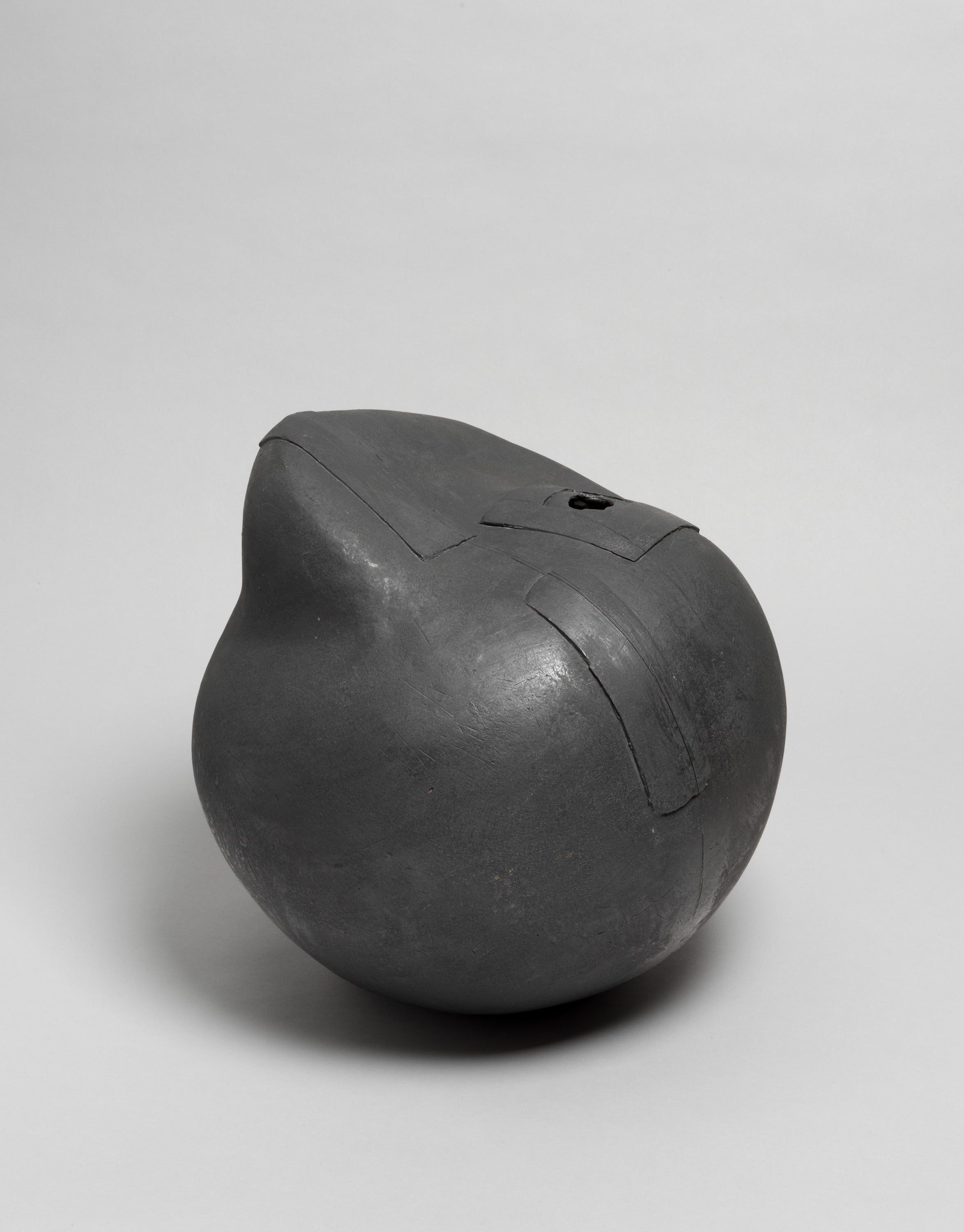 Round Vessel in Black with Relief