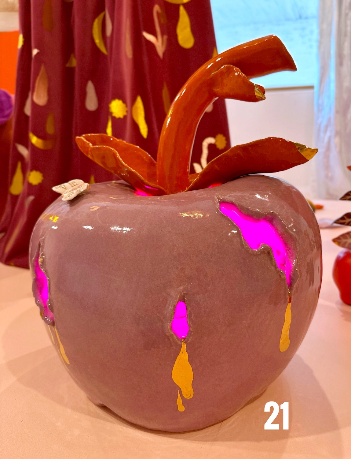 Glowing Apple 2023, Glazed stoneware, porcelain, gold luster, electrical components, lamp $3,000 *c