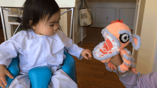 playtester interacting and feeding the Ky Lan puppet