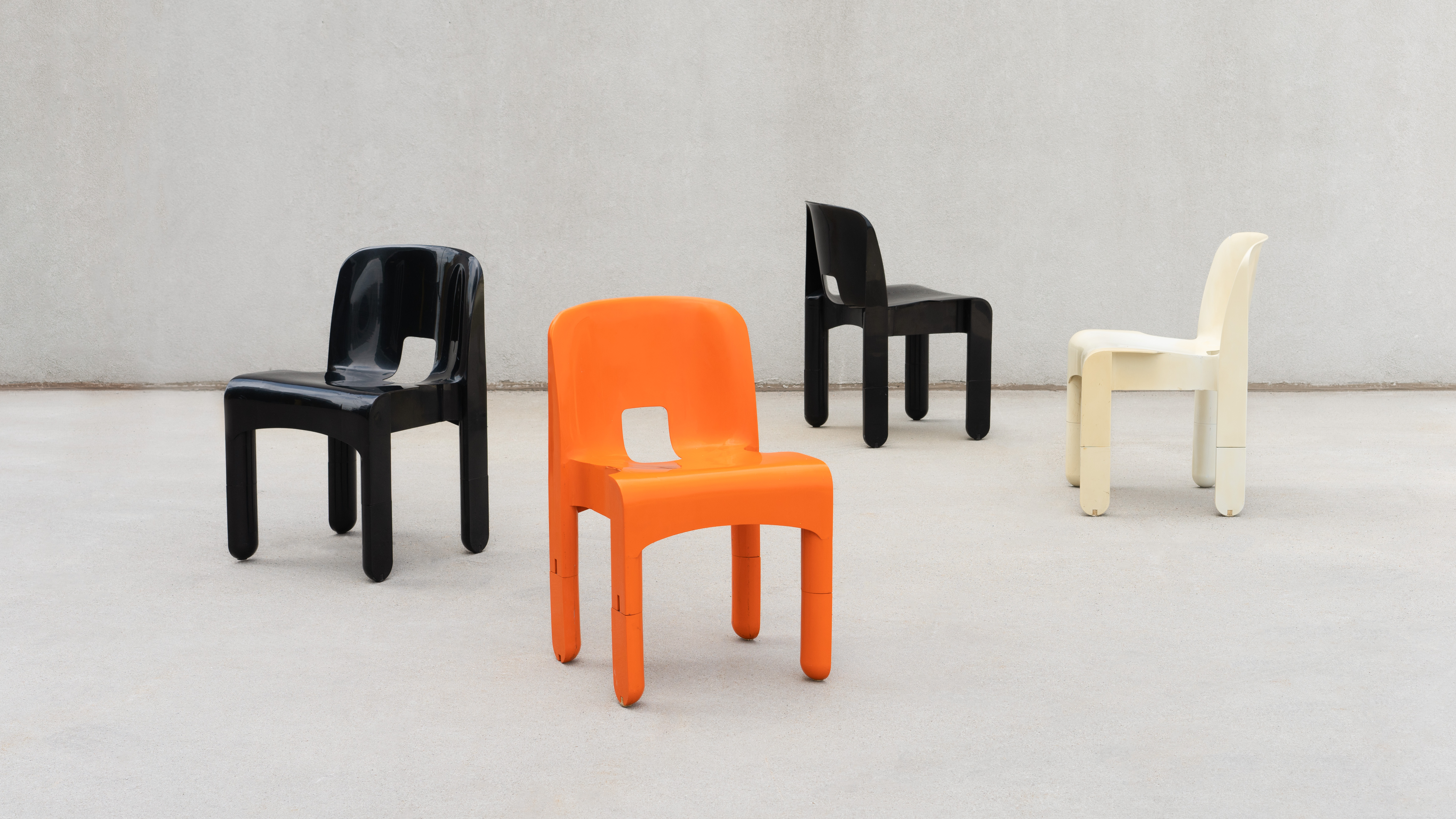 SWEETERFAT KARTELL UNIVERSALE CHAIR PRE PRODUCTION ORANGE BLACK WHITE PLASTIC SPACE AGE CHAIR DESIGNED BY JOE COLOMBO 