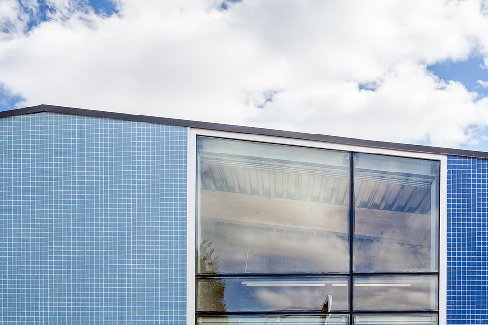Detail photo of Mount Pleasant School addition tile and glass facade