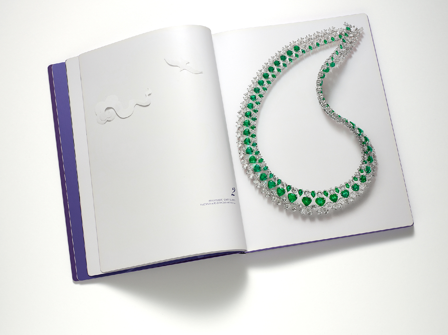 KMA photographer Isabelle Bonjean shoots emerald necklace for Chopard against white background
