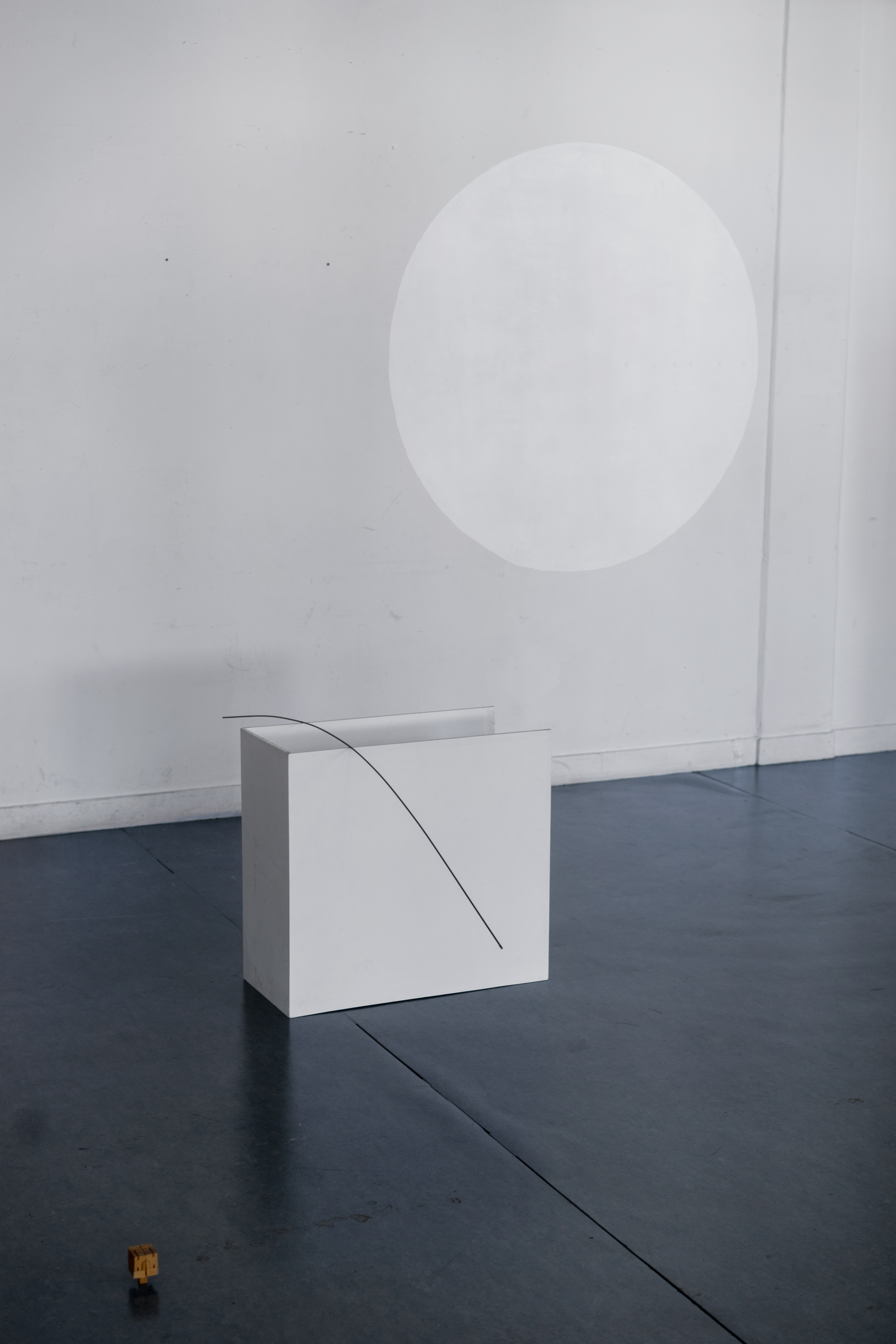 White circle, line on the floor and grey door, 2018