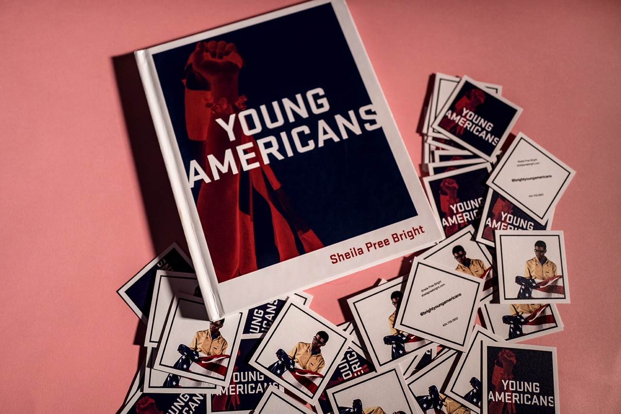 Above view of the Young Americans book cover and square Young Americans branded info cards surround the book.