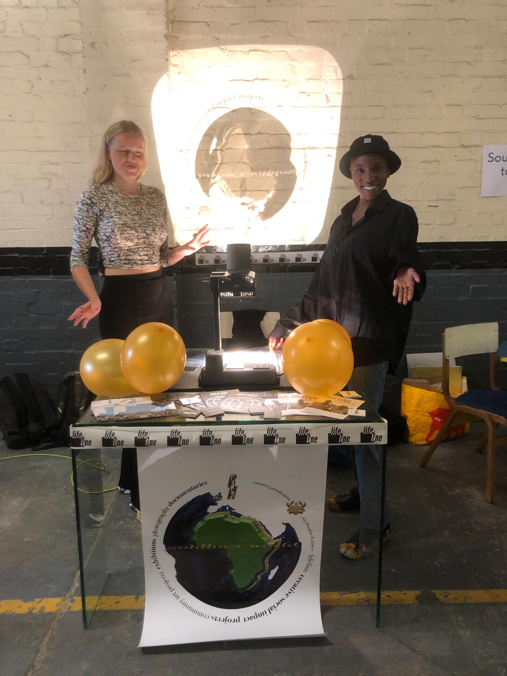Local producers/researchers Gold Host, at their info stall during the opening party.