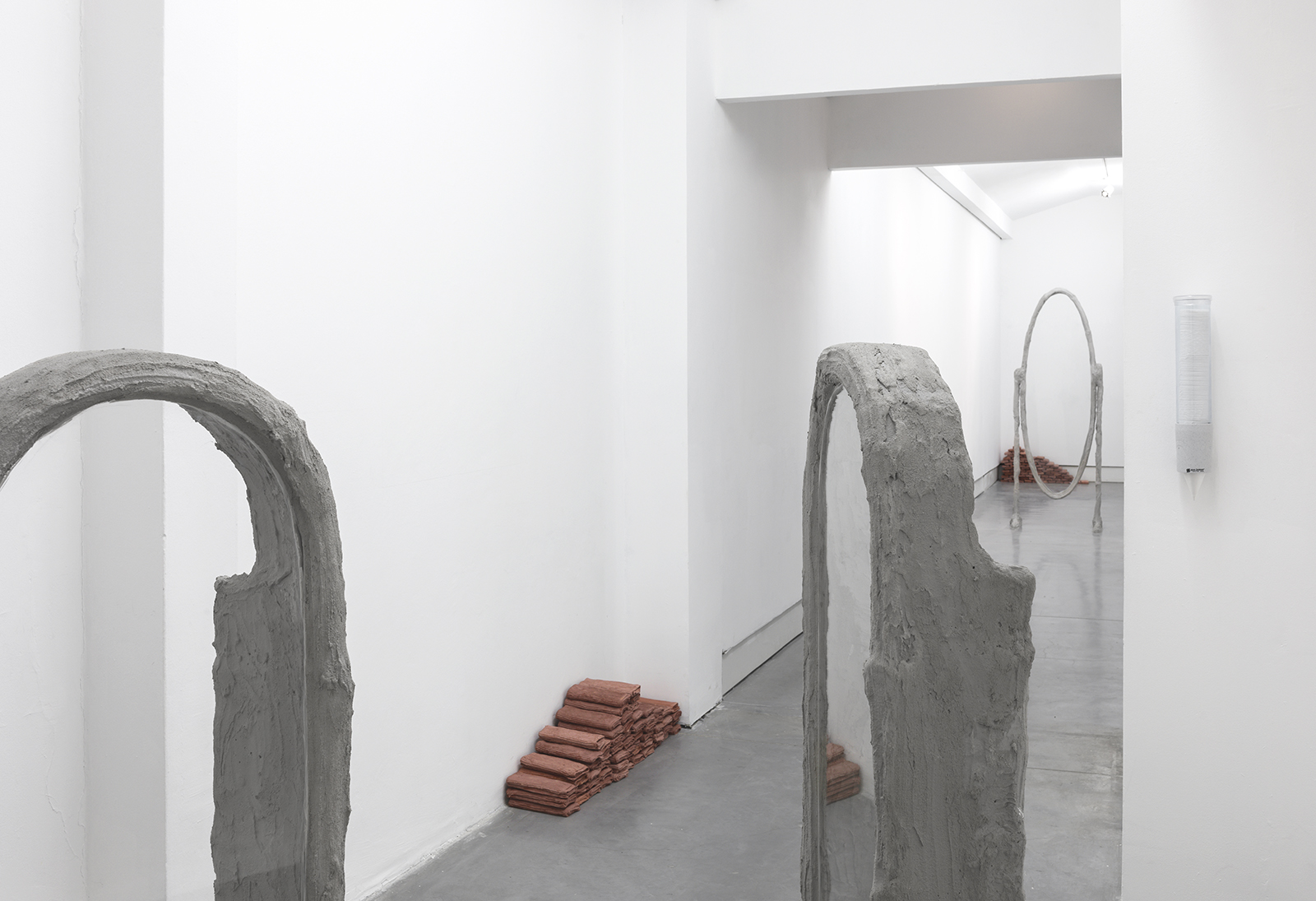 Springs, 2017, concrete, steel, burlap, glass, vaseline, egyptian loofah, hand towels, plaster, pigment, cup dispenser and paper cups