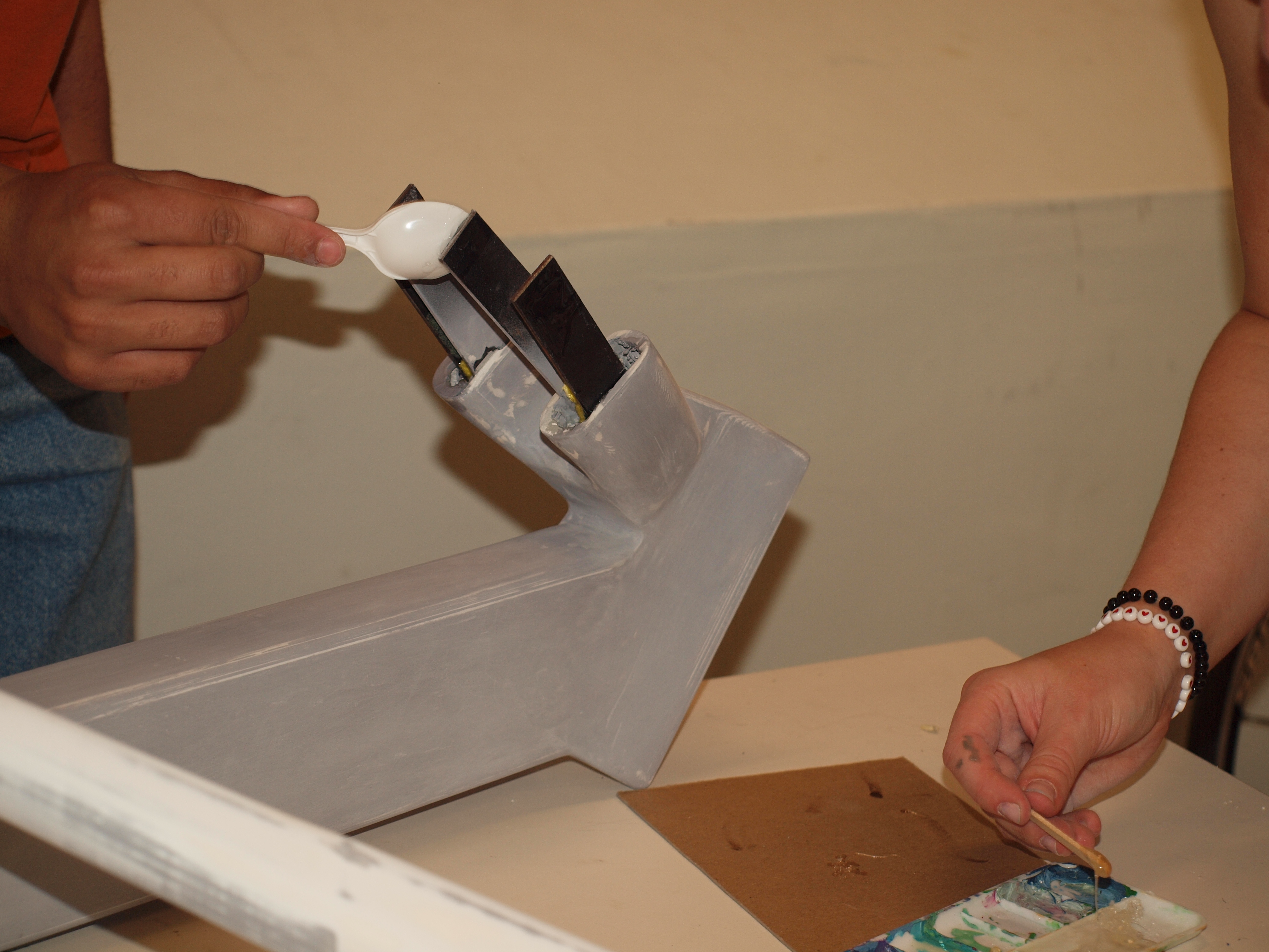 internal skeleton held together by plastic spoons