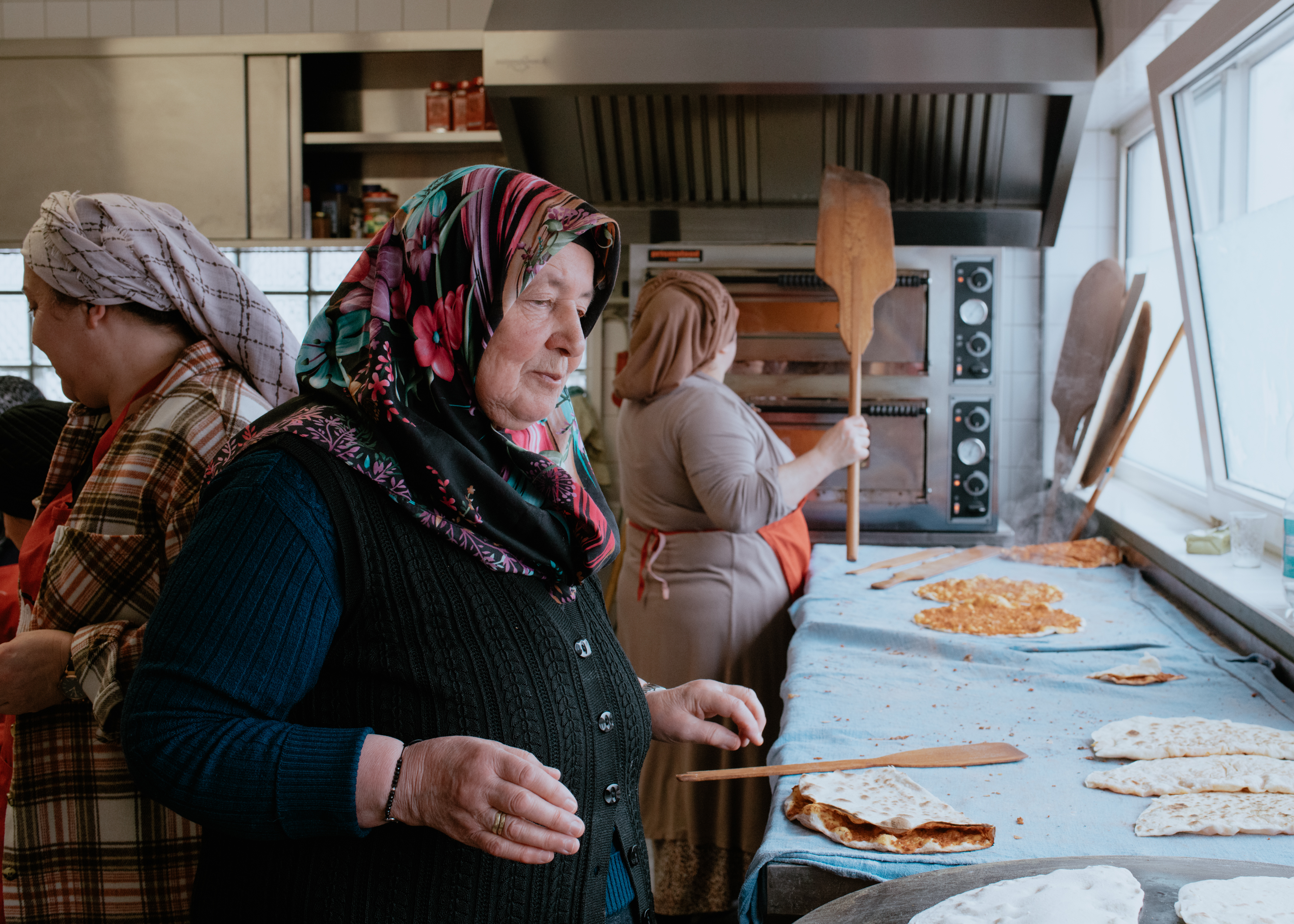 Women of the mosque prepare lahmacuns. The proceeds of the sale will be donated to the earthquake victims in Turkey.