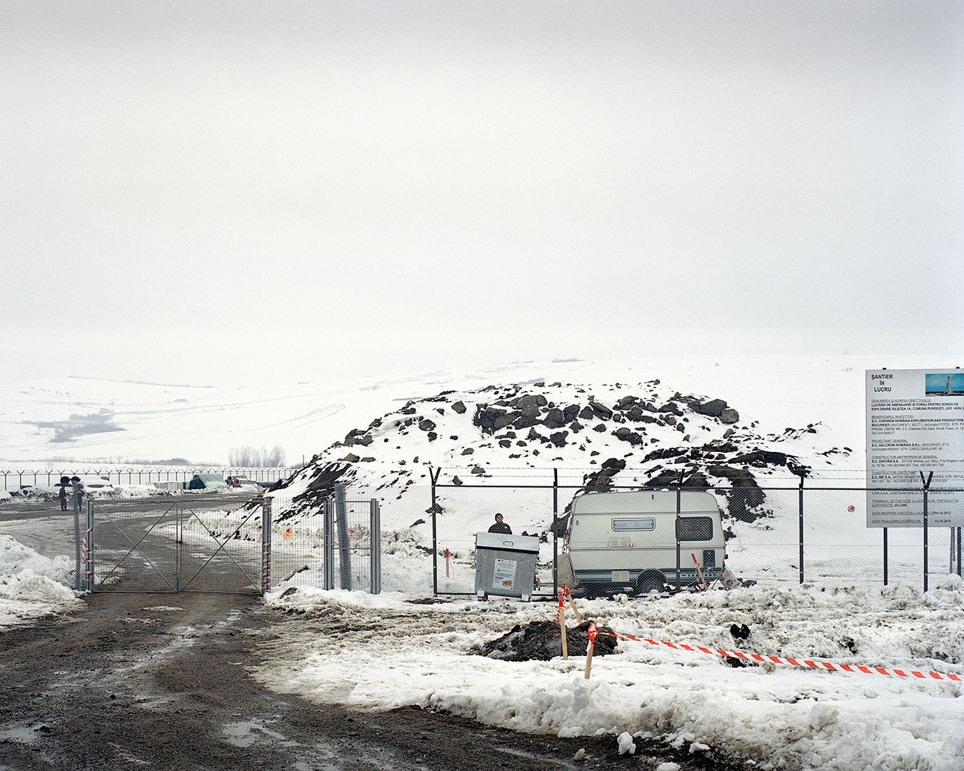 Pungesti, Romania. The entrance to the Chevron shale gas extraction site in Pungesti, eastern Romania. On the 7th of December 2013, during some violent protests against fracking, the fences of the platform were totally destroyed by the population. Since that day, the Romanian government led by Prime Minister Victor Ponta, declared the area a special security zone. This decision entails a constant presence of the Gendarmerie on site and restricted access to the village