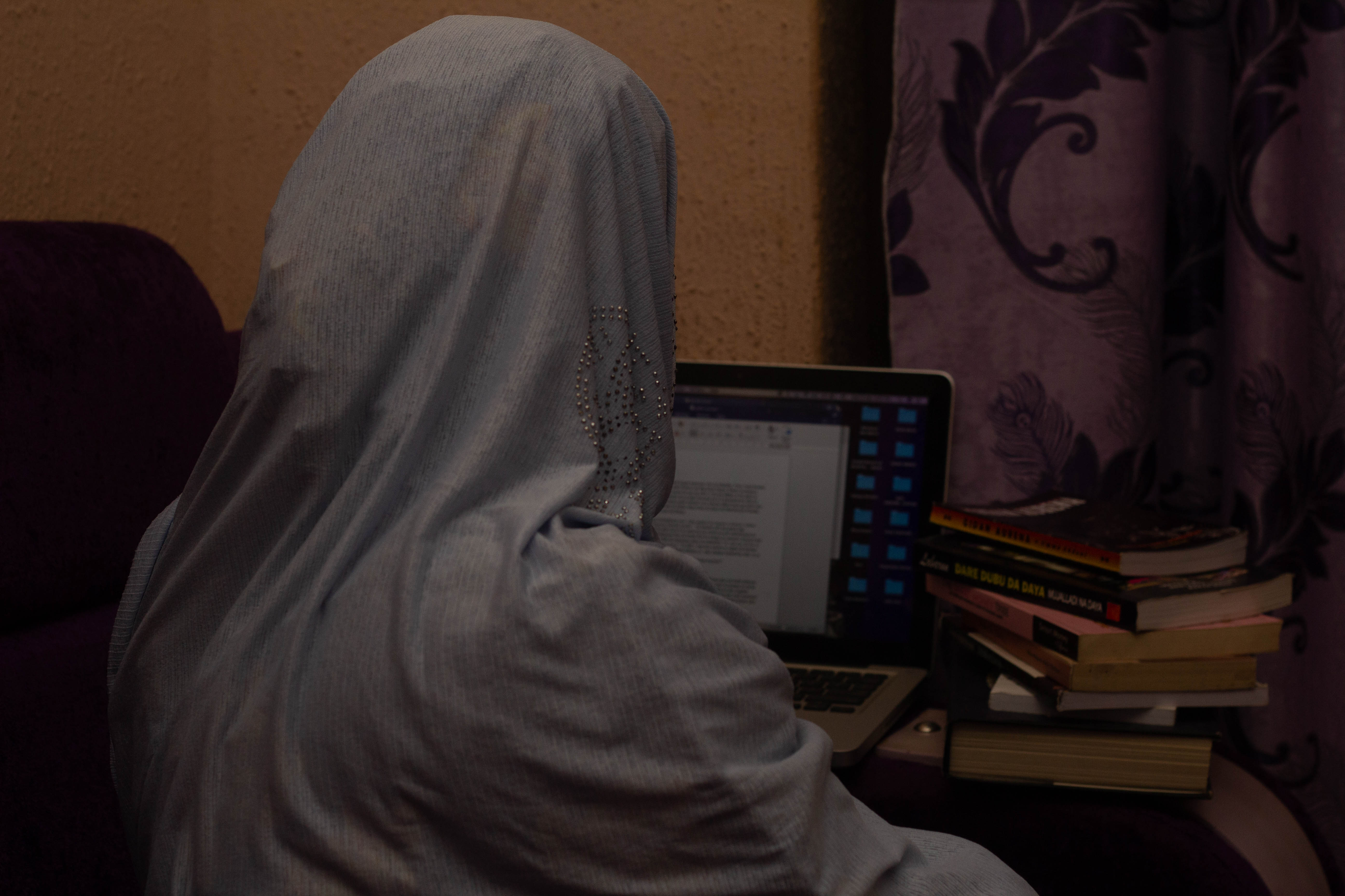 Safiyyah Jibril Abubakar working on a manuscript