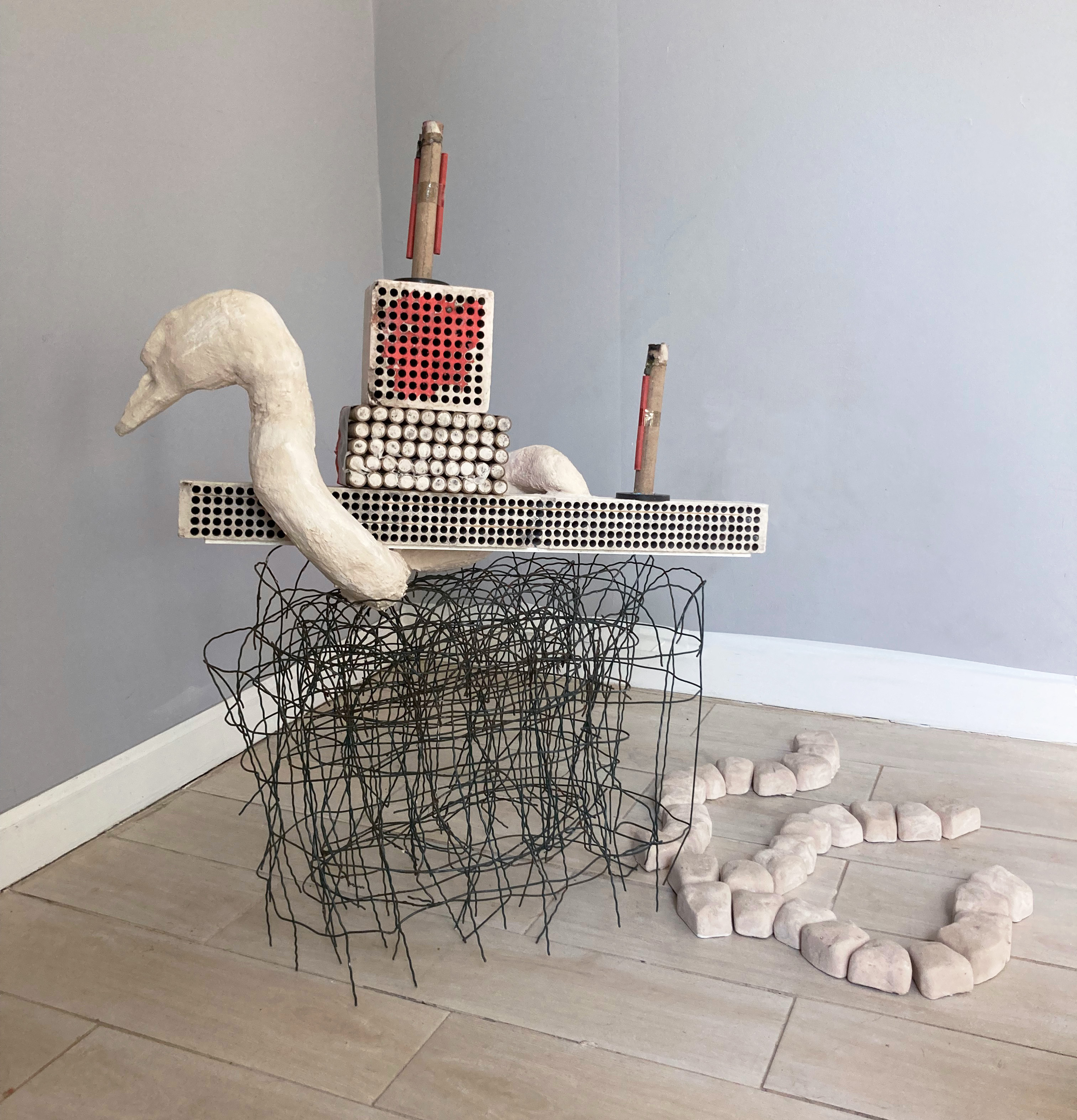 Air Tower, 2023, Found firework refuse, wire, aquaresin, 40" x 12" x 34"