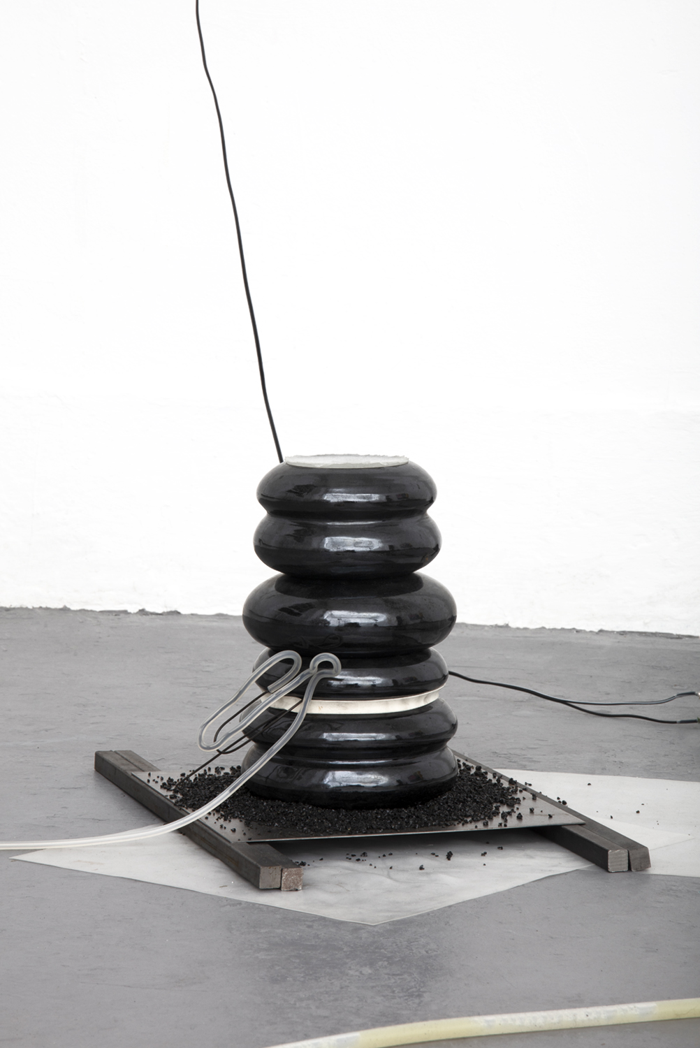 The propensity of things, 2019, [various dimensions], Slade Interim Exhibition  Whey protein powder, silicone, black mirror glaze on terracotta ceramic,   volcanic sand, wire, rubber band, glass, steel 
