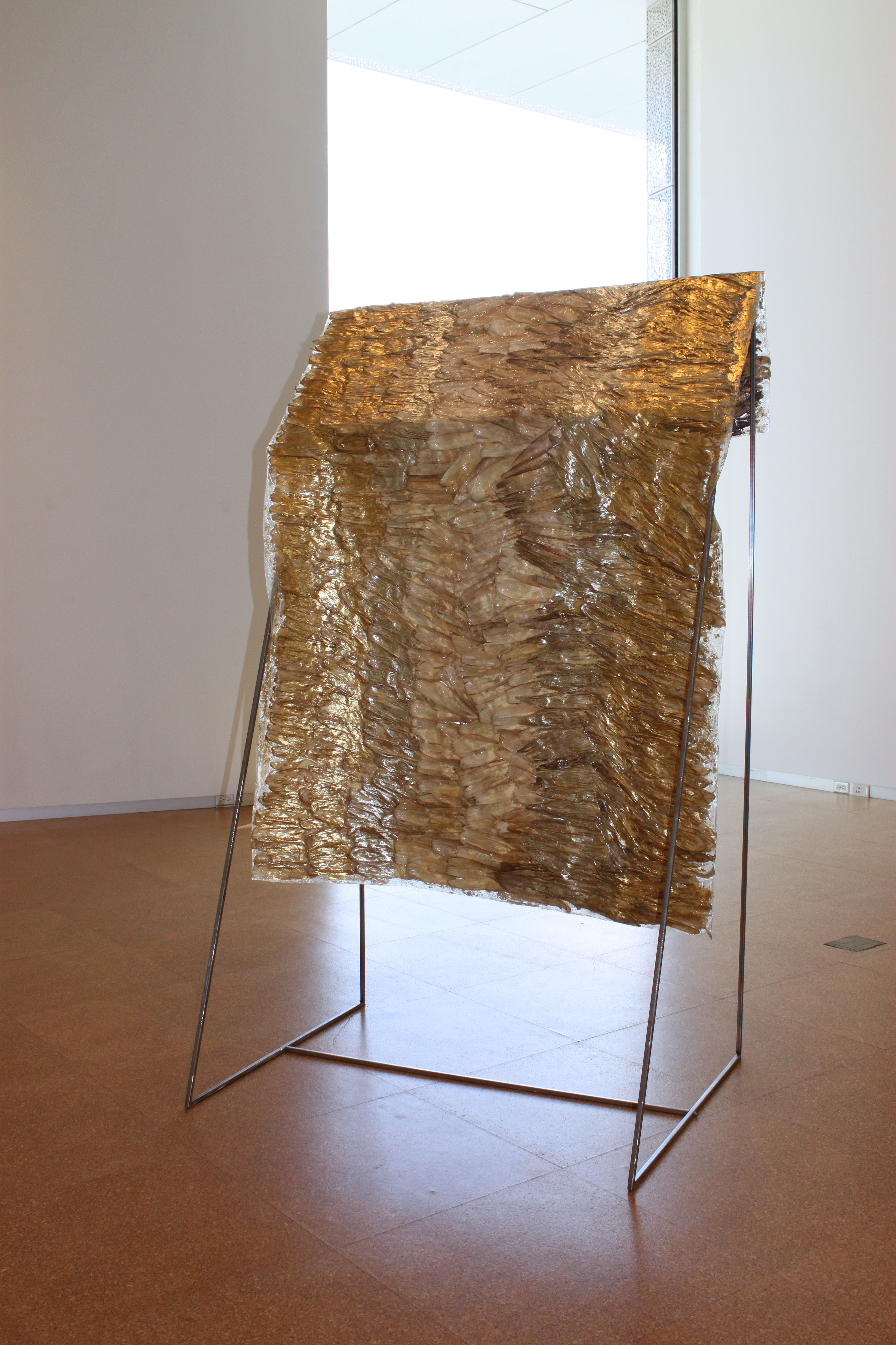 Cornhusk Cloak, cornhusks, hot-pressed foil and steel, 5 x 10 x 5 feet