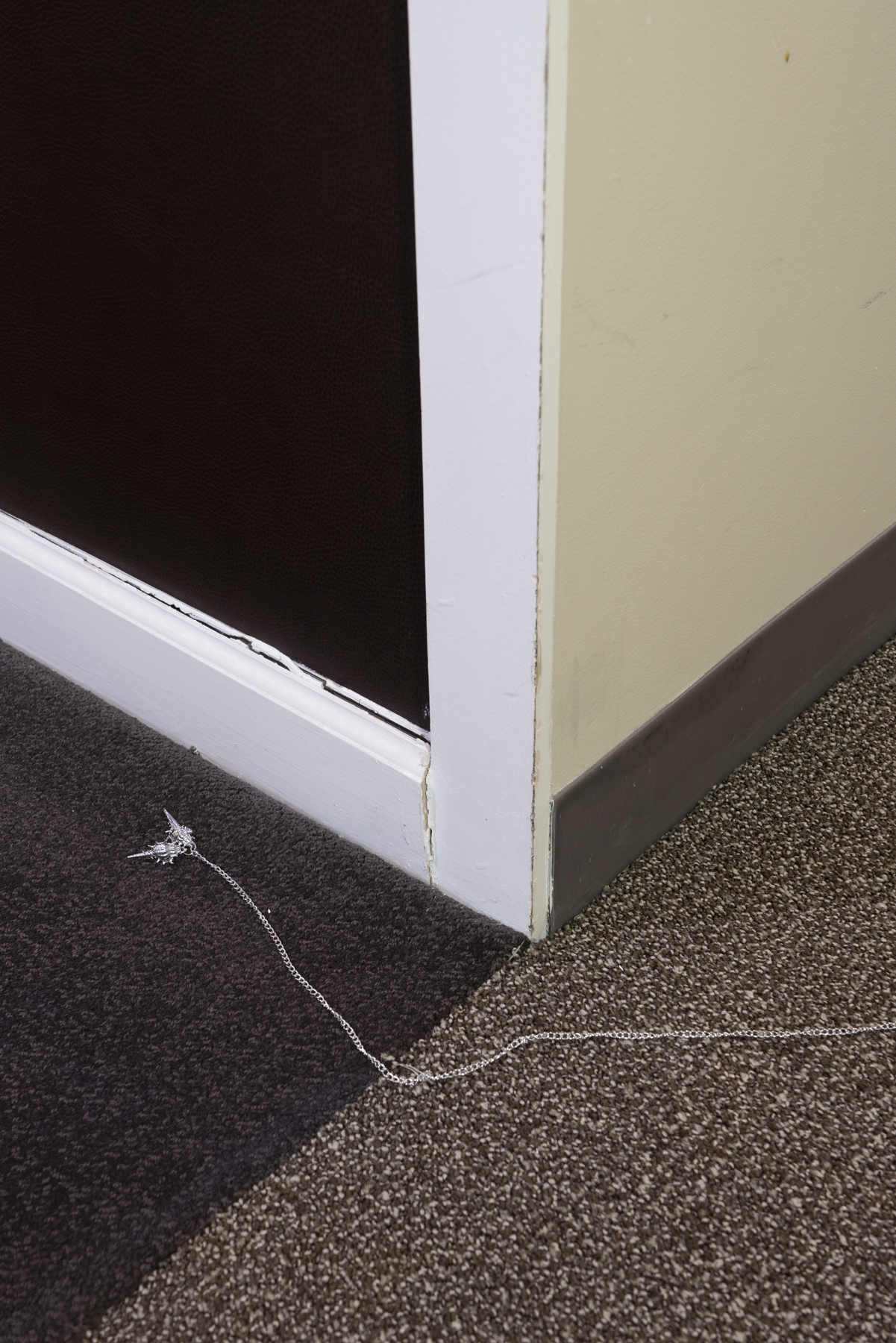 Intrusion, keys to the gallery space, key ring, stainless steel pendants Photography: Jesse Meredith