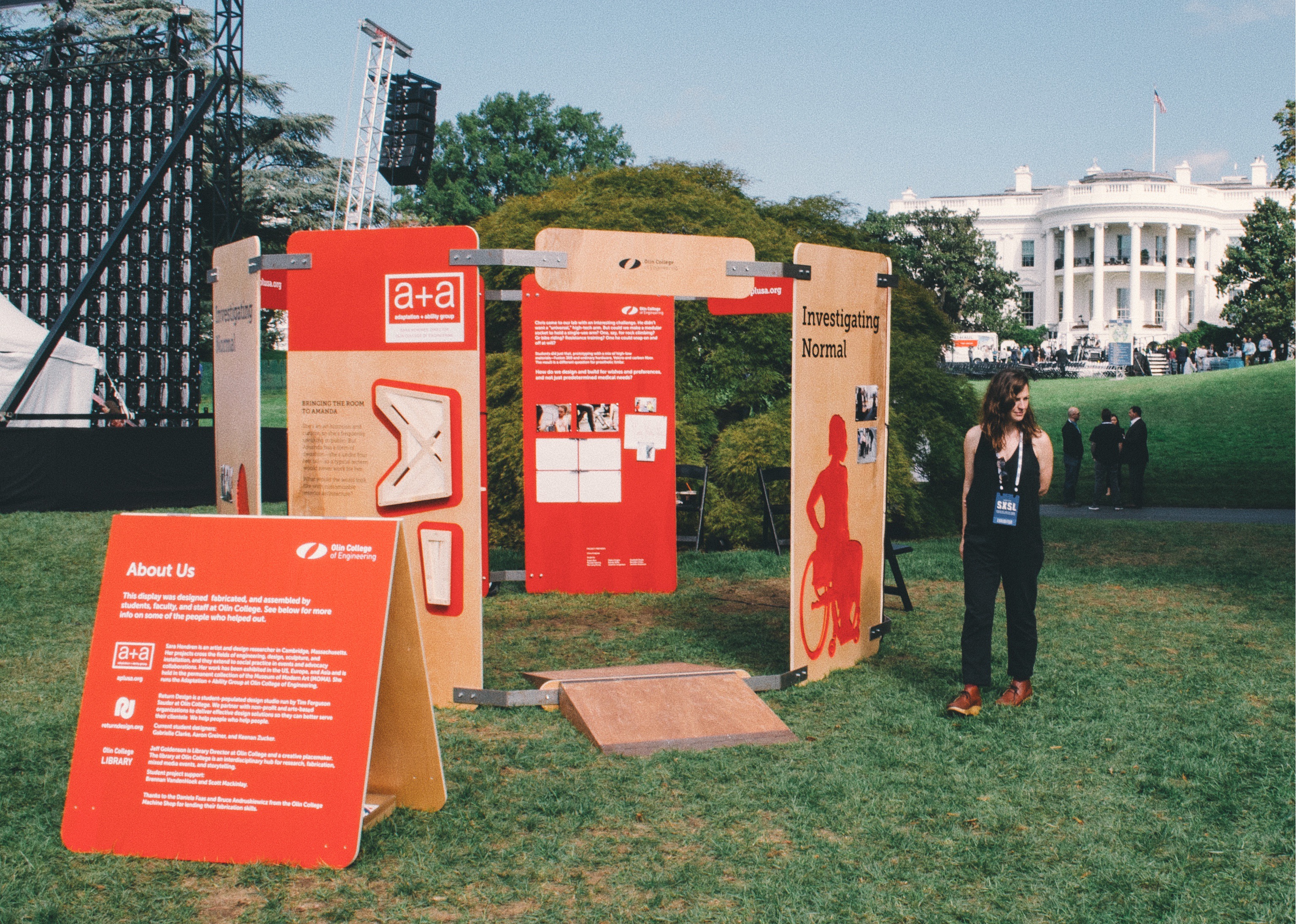 Olin professor Sara Hendren at the exhibit featuring works from her adaptation + ability lab with the White House in the background.