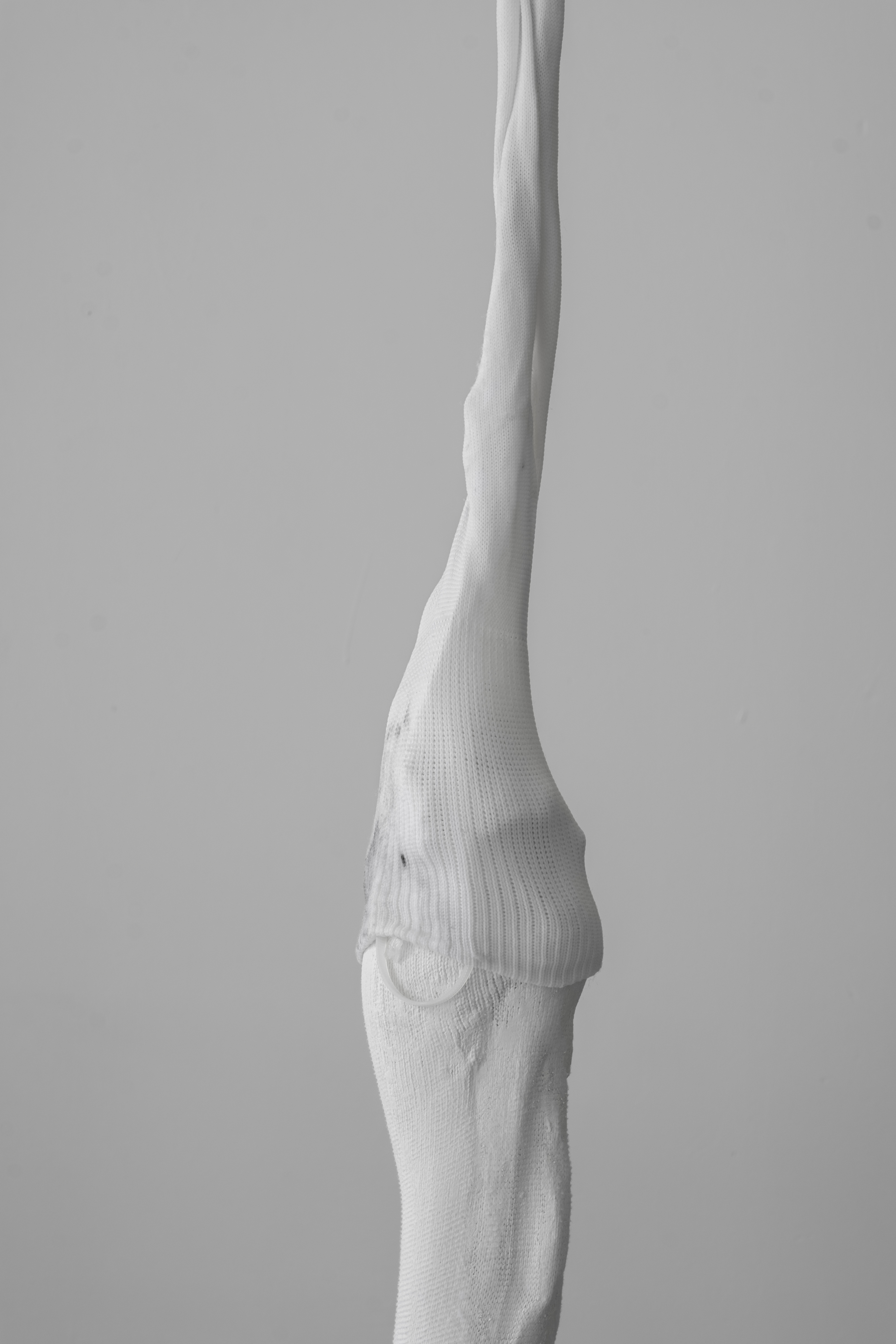 Then, Ghosts. 2021, Socks, Concrete, Glass-wax, Armature Wire. dimensions variable