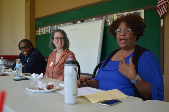 Effie Burt speaks next to Jessica Richardson and Rhondalyn Peairs