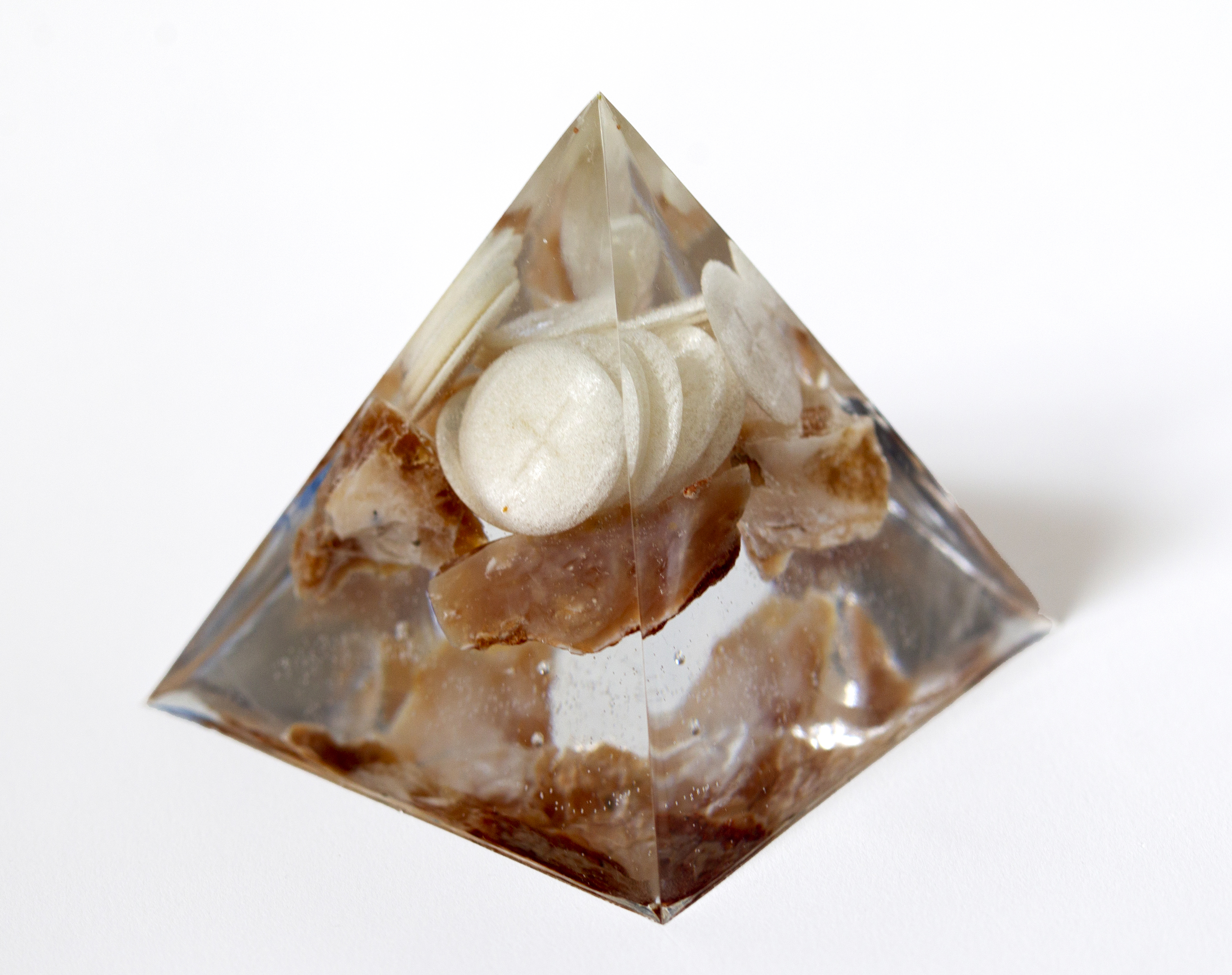 Busser, 2021, 4"x4"x4". Honey opal, wheat communion wafers, epoxy resin