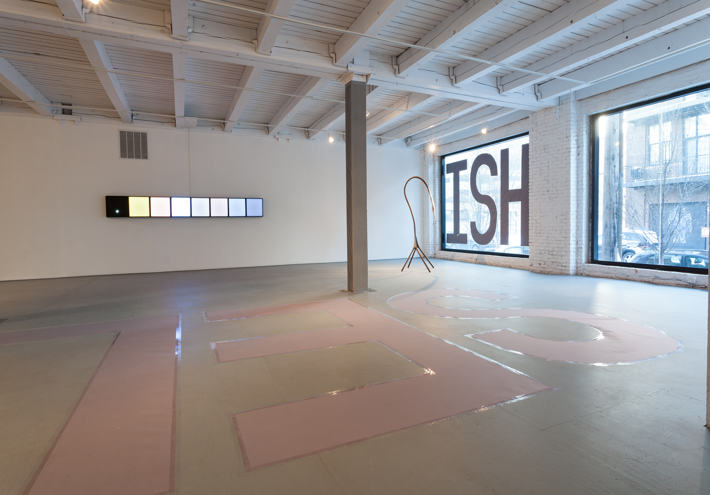1/5 — SELFISH.  Site-specific installation created for the exhibition Hiding in Plain Sight, curated by George William Price at the Chicago Artist Coalition; hand-cut paper, packing tape; text on floor "SELF" measure 144" x 48" each, text on window "ISH" 96" x 48" each) 2017.