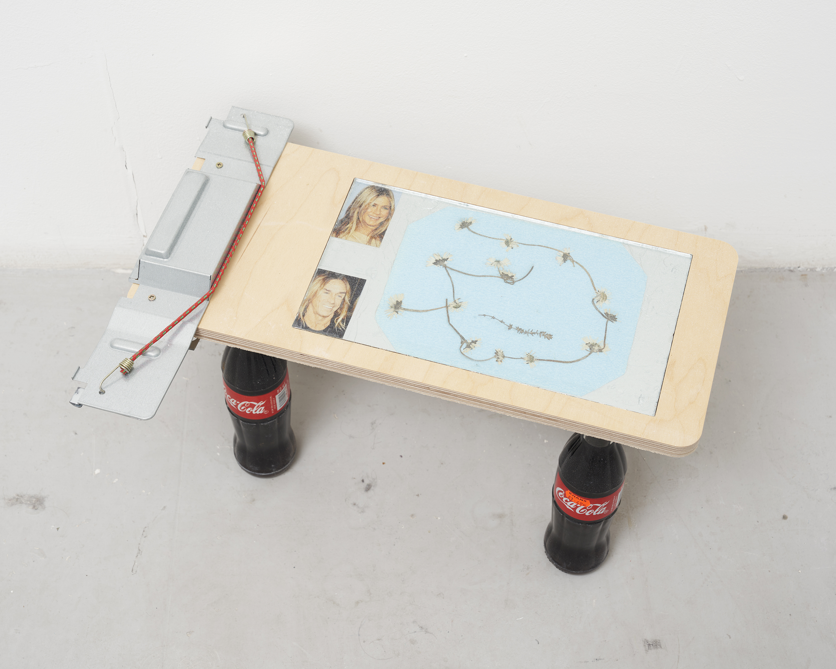 Sequencing plug [I wanna be your dog], 2022. (Transparencies, insulation tape, glass tile, aluminium, ply & x4 imported Coke bottles)