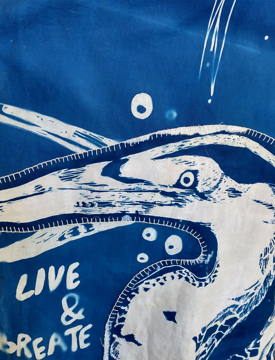 Close-up of To Feel and Expresscyanotype on cotton fabric. 2022