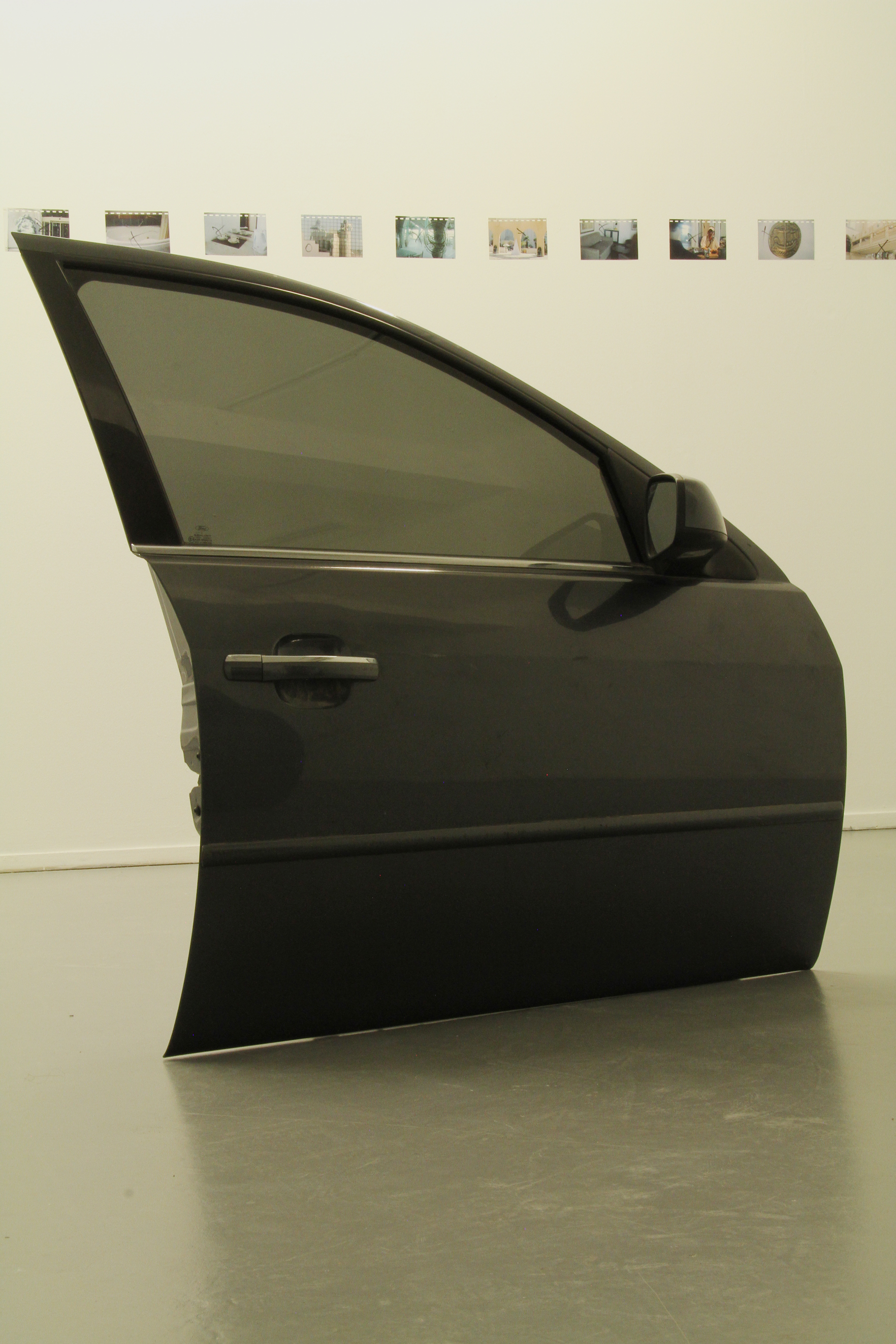 Gamblers&rsquo; Breath, 2014  Ford Mondeo front doors connected to a floor metal device, 110x96x14 cm