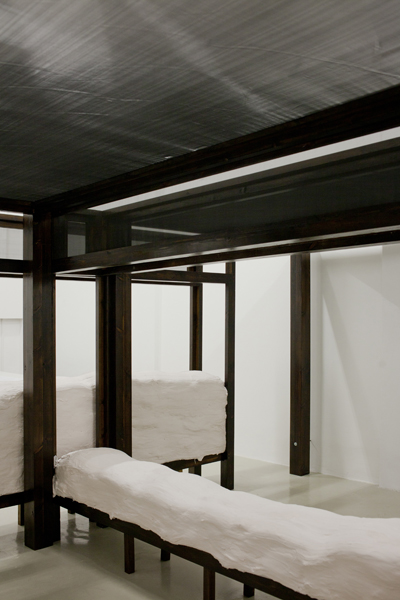 The Contagious Bride, 2012, variable size, wood, stain, screen, sand bags, plaster