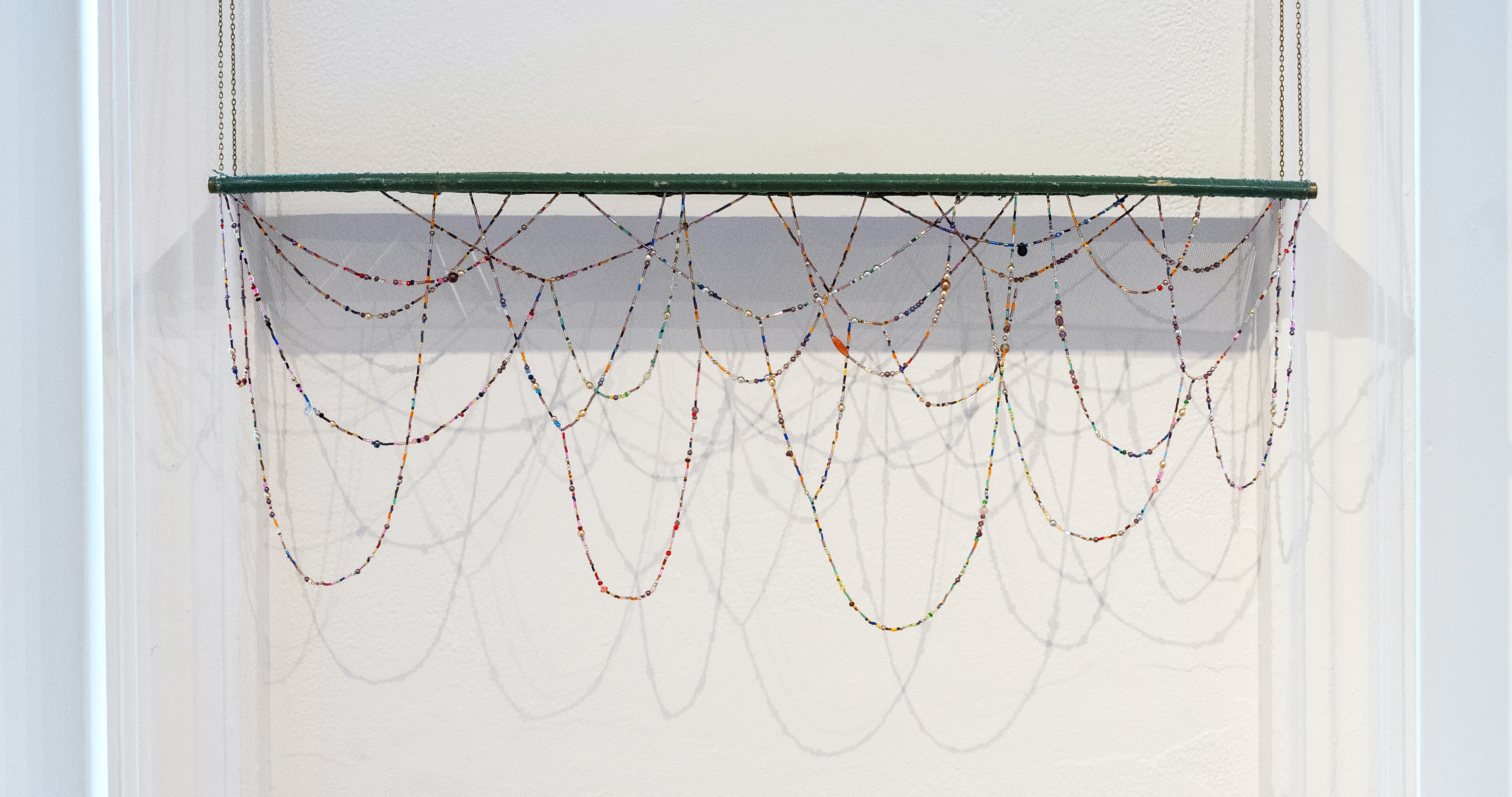Roots | Found heddle, chain, beads | 37 x 33 x 6 in | 2025 | Photographs by Anna Brewer