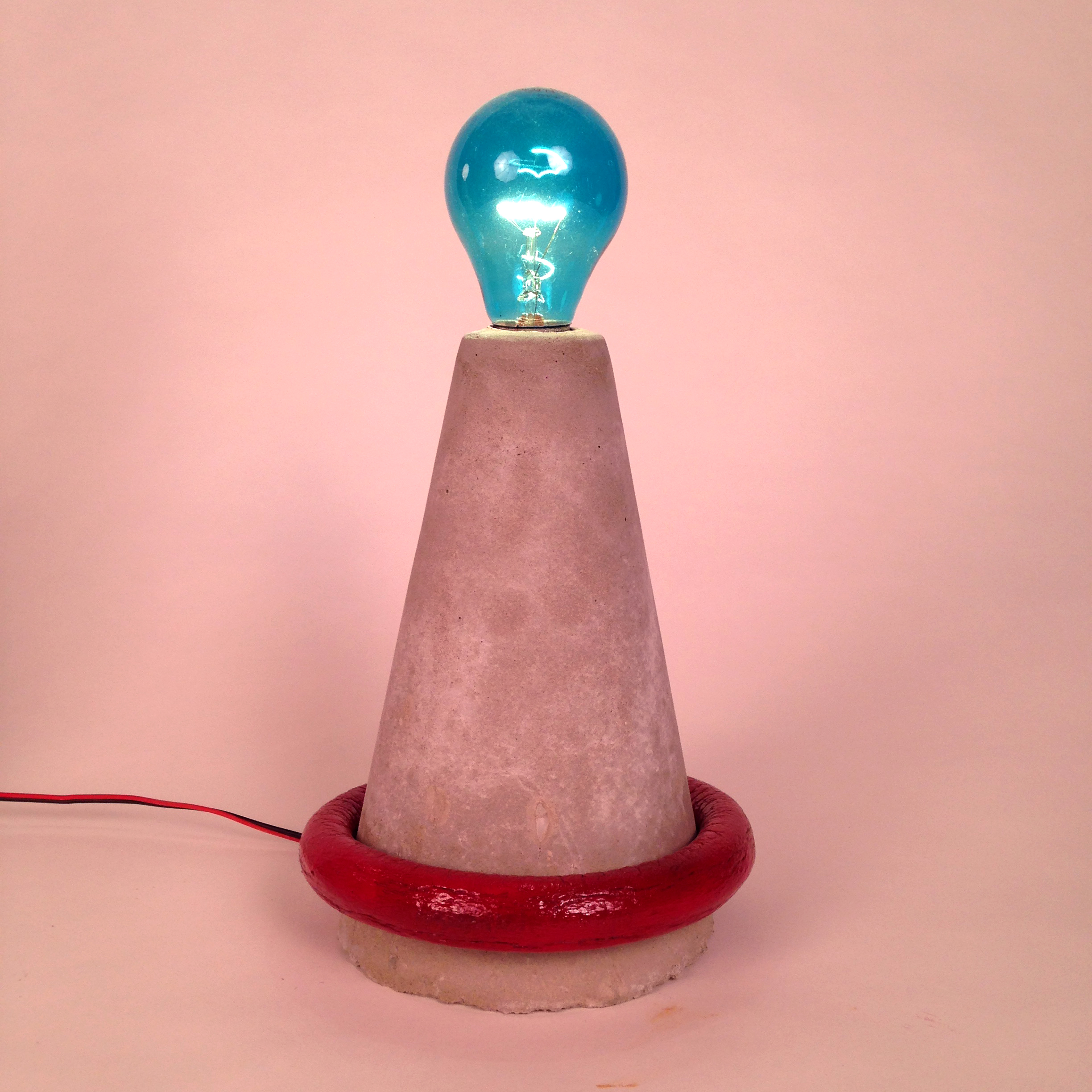 'Cone Light (with Red Ring)'. Concrete and foam tube