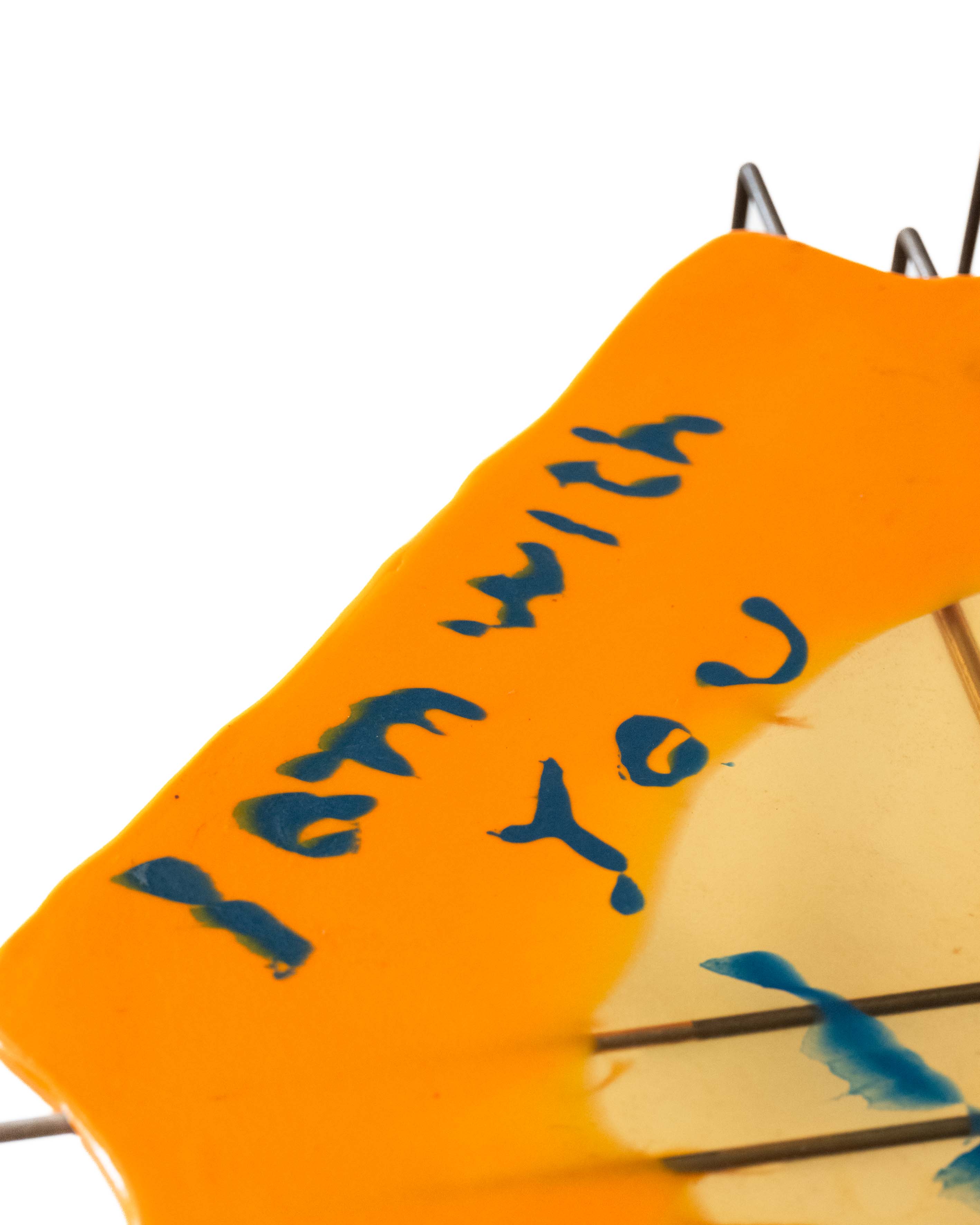 closeup of the words I am with you on the I am with you table by Gaetano Pesce for the tbwa/chiat/day office in 1994, nyc, shown in the work/life imbalance show by sweeterfat July 1st 2025