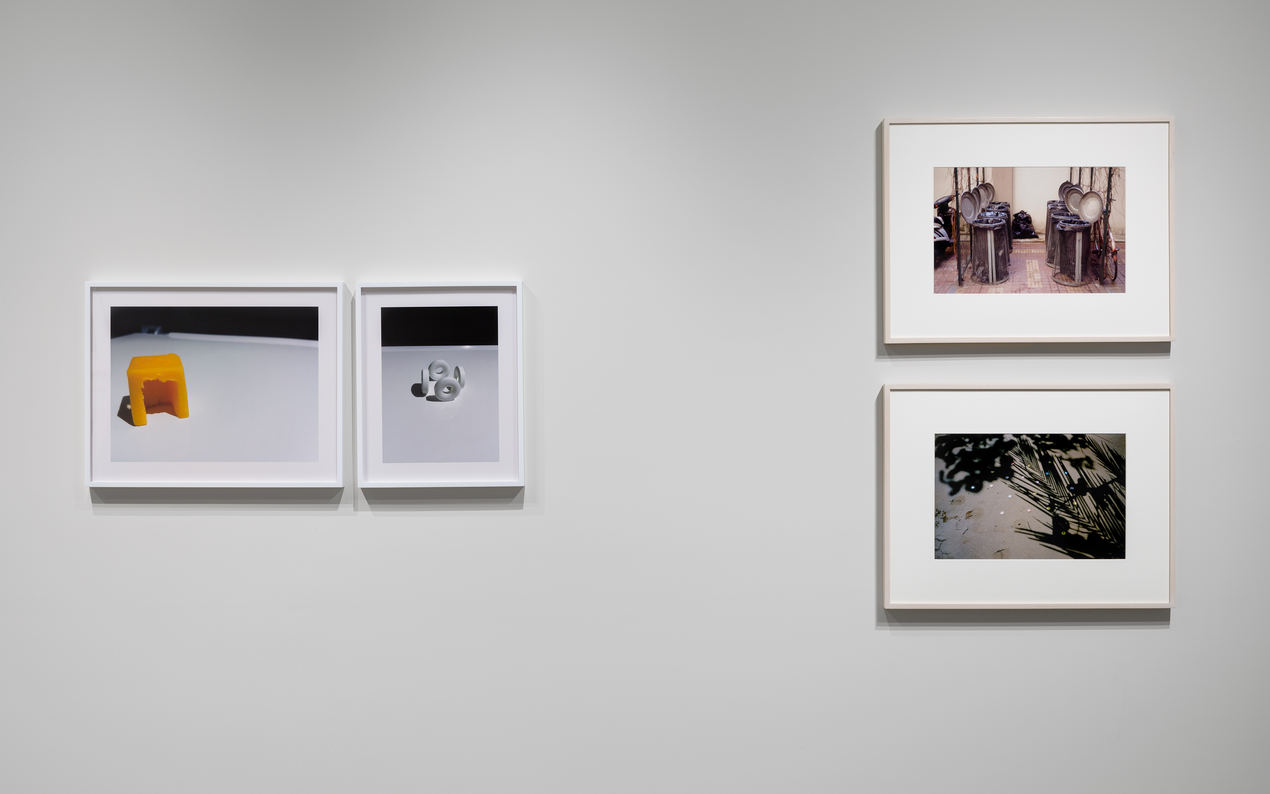 From left: Nina Katchadourian, "Cheese Hut," 2012 ("Seat Assignment" project, 2010 and ongoing), C-print, Edition of 8 + 2AP; edition X/8 19 x 24 inches. Nina Katchadourian, "Sun Tunnels," 2012 ("Seat Assignment" project, 2010 and ongoing), C-print, Edition of 8 + 2AP; edition X/8, 19 x 15 1/4 inches. Gabriel Orozco, "Trashcan Opera," 1995, Dye destruction print, 12 1/2 x 18 3/4 inches. Gabriel Orozco, "Star Caps," 2001, C-print, 16 x 20 inches. 