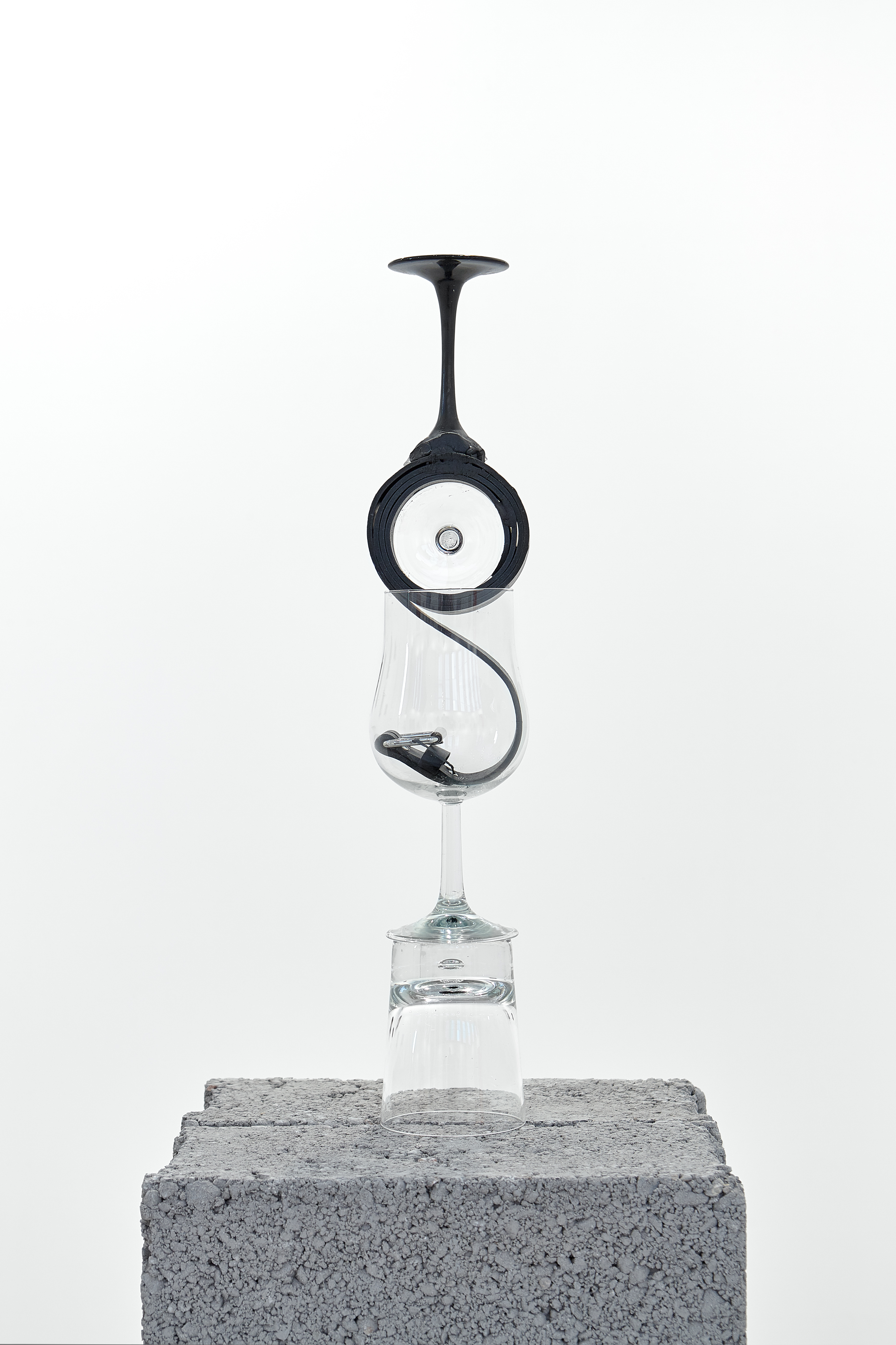 Gold, 2022  Whisky glass, Wine glass, Leather belt, Wine glass stems , Rubber webbing 9.5 x 9 x 56.5 cm