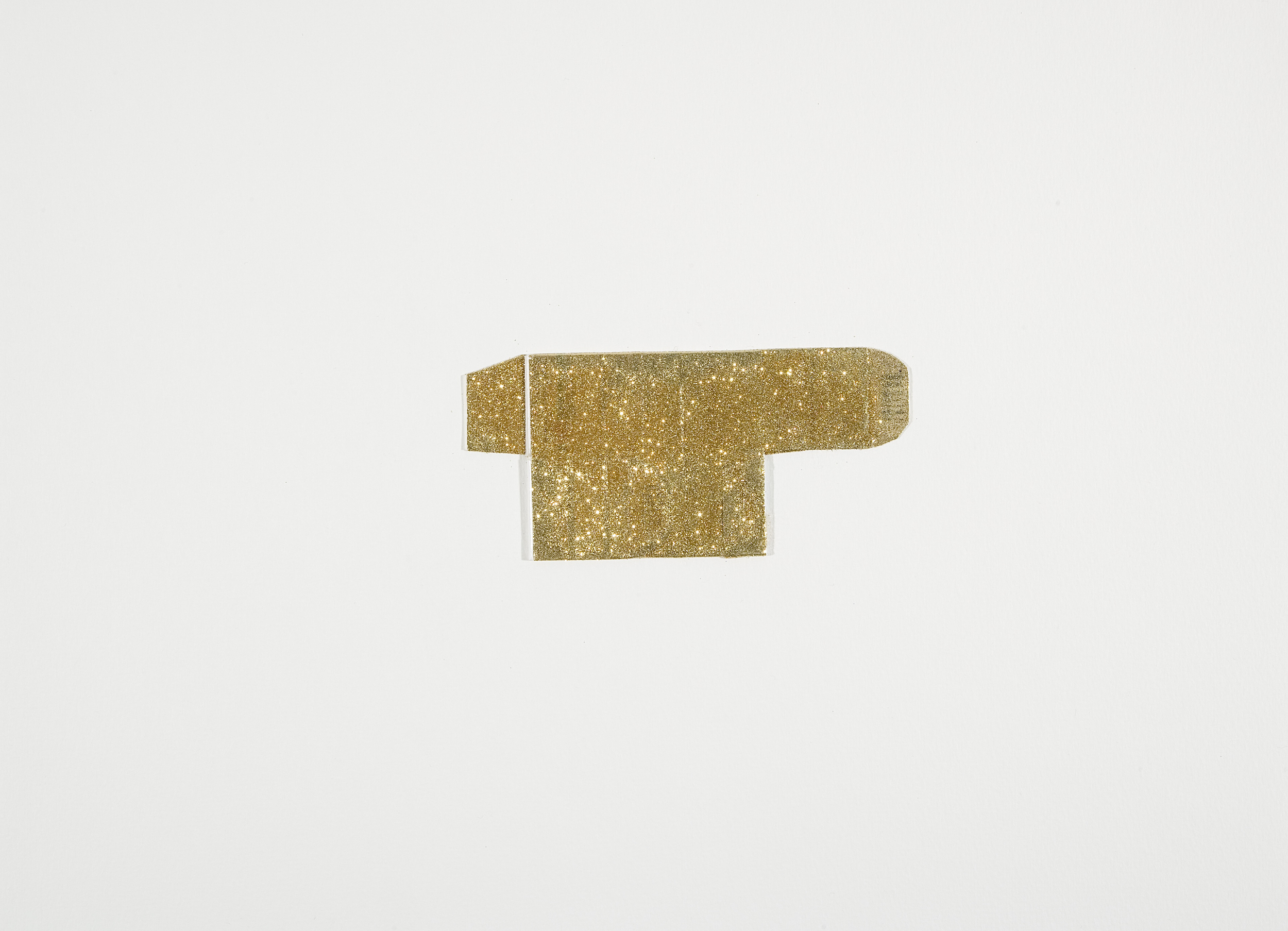  Golden Placebo, 2015, Glitter on folded medicine box mounted on white paper . 25 x 35 cm