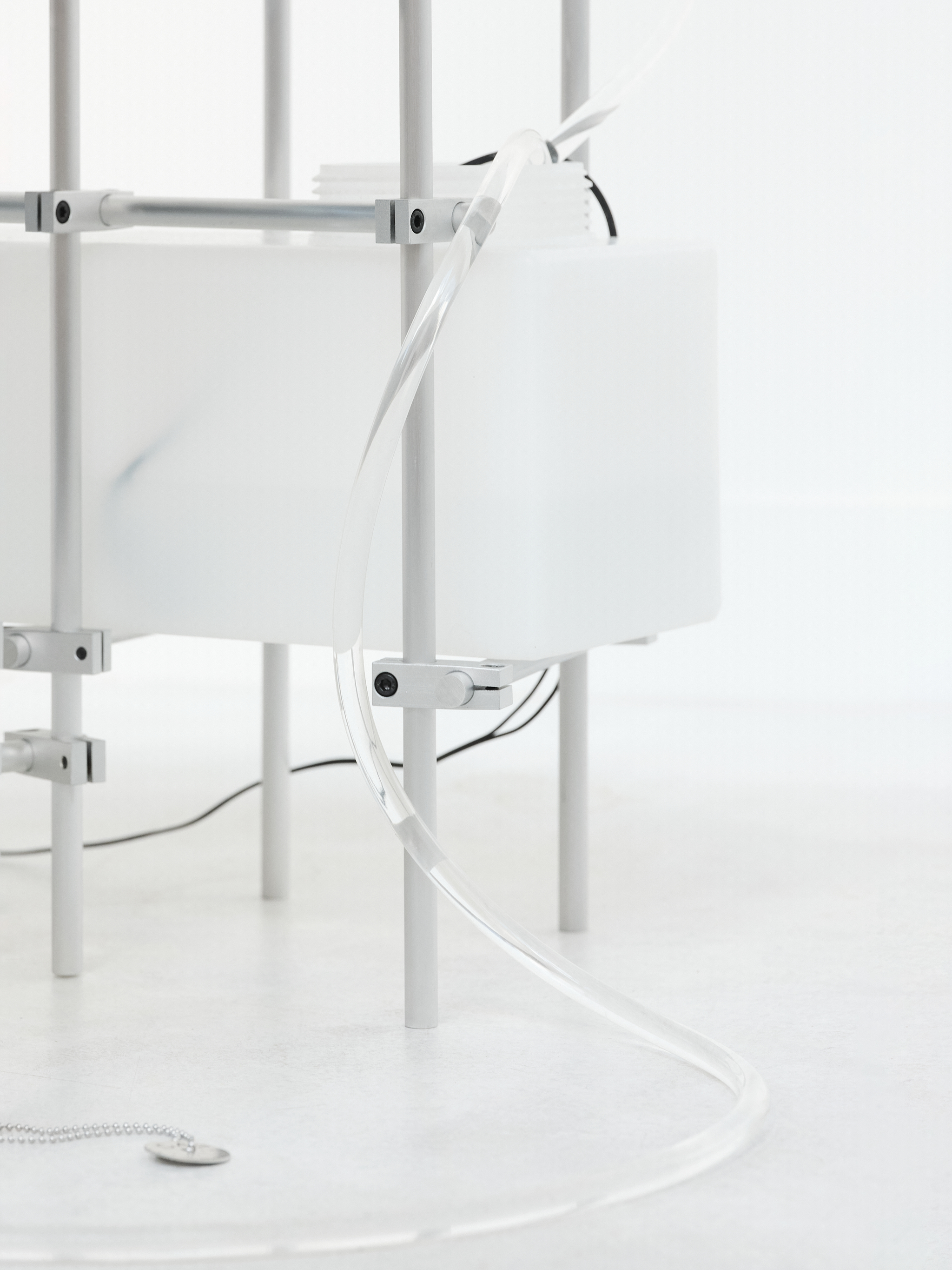 Future Obscura, 2025, [120m x 80cm x 65cm]  Art-O-Rama invited by Xxijra Hii Gallery, Marseille  Glass, water, eco resin, wool, aluminium, stainless steel, PVC tubing, water tank and pump. 