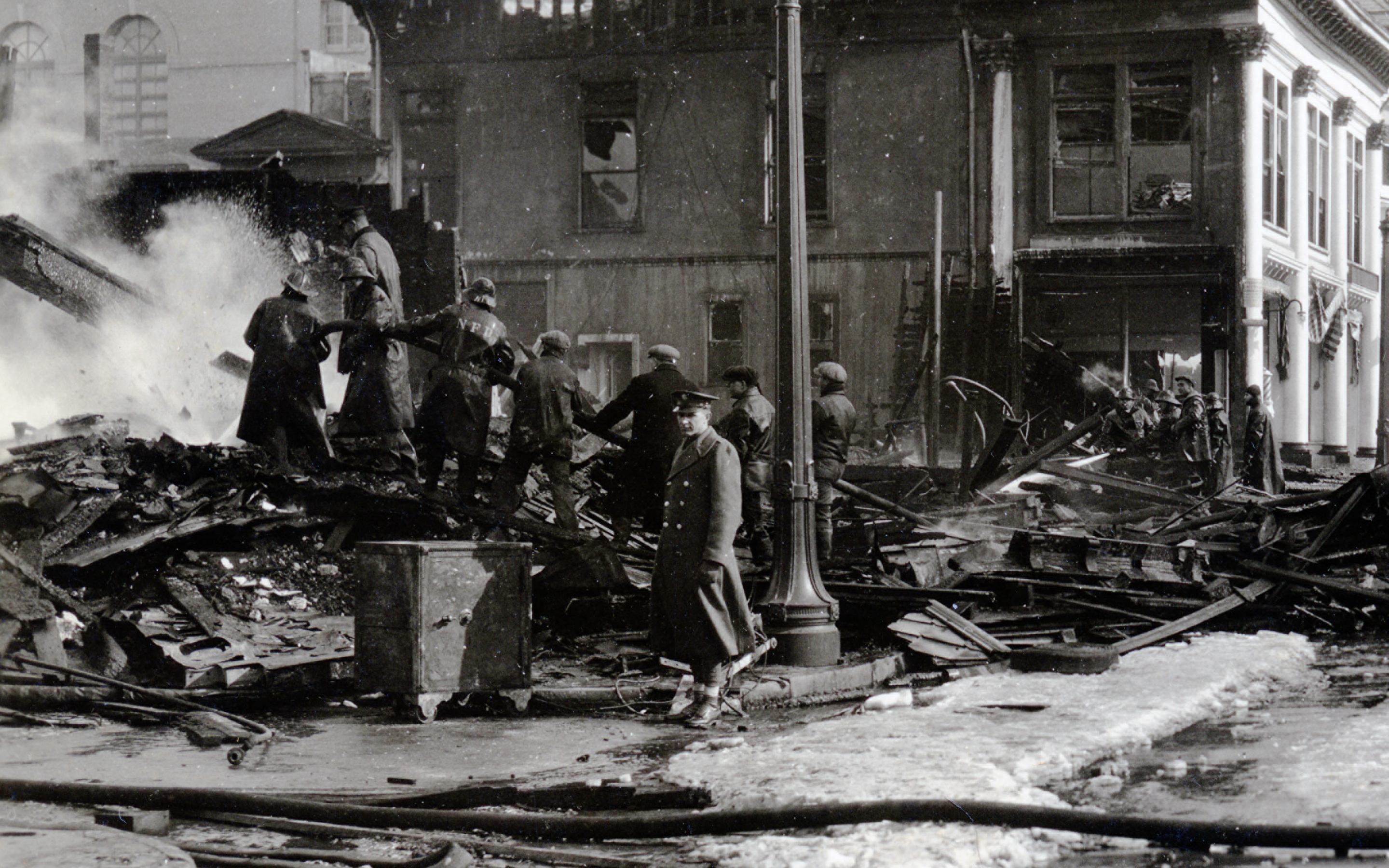 Firefighters extinguishing fire on the north side of Washington Square