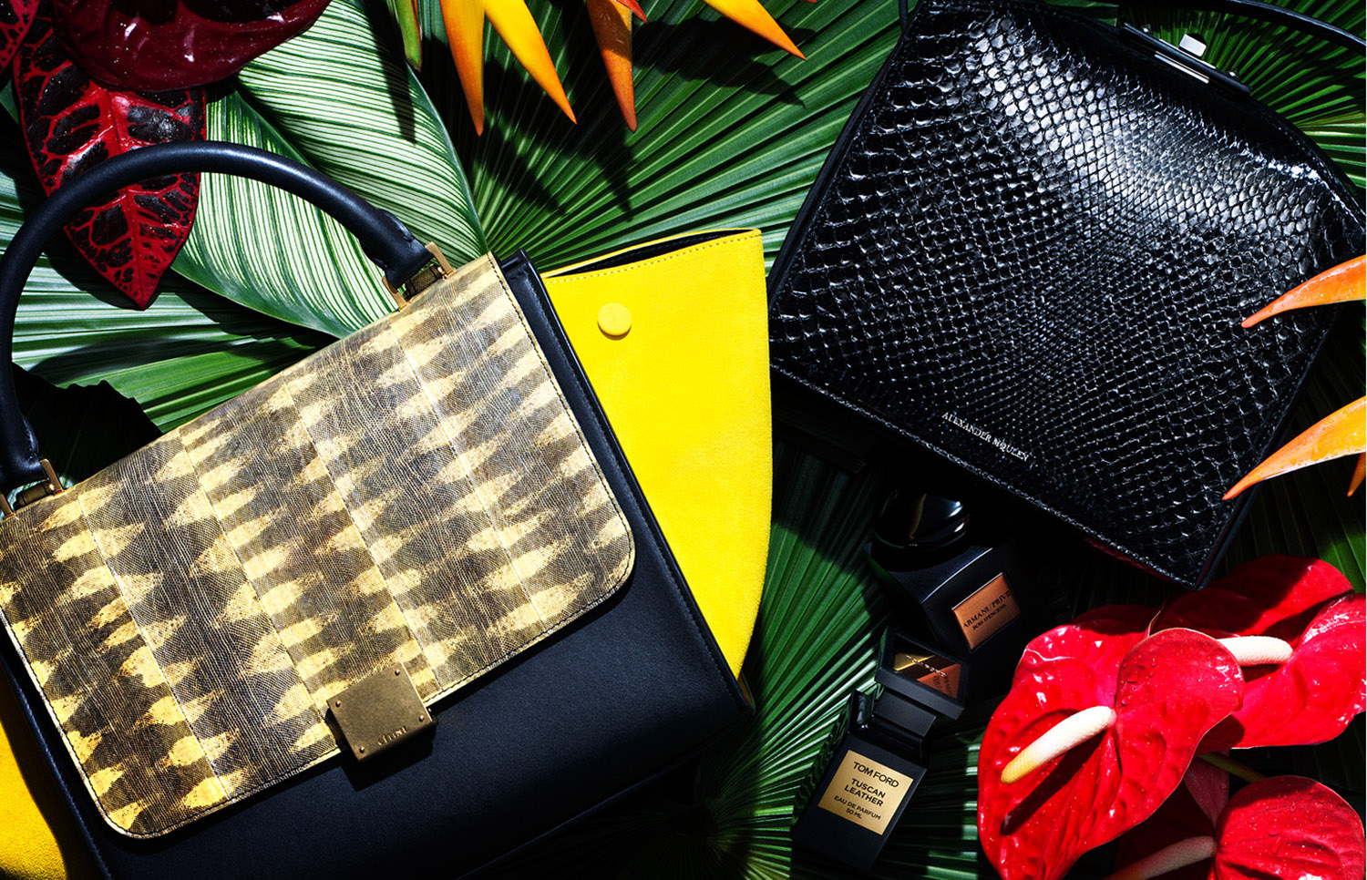 KMA stylist Sara Wacksman designs set for a photo of designer purses and perfumes on tropical flowers for Heroine Magazine