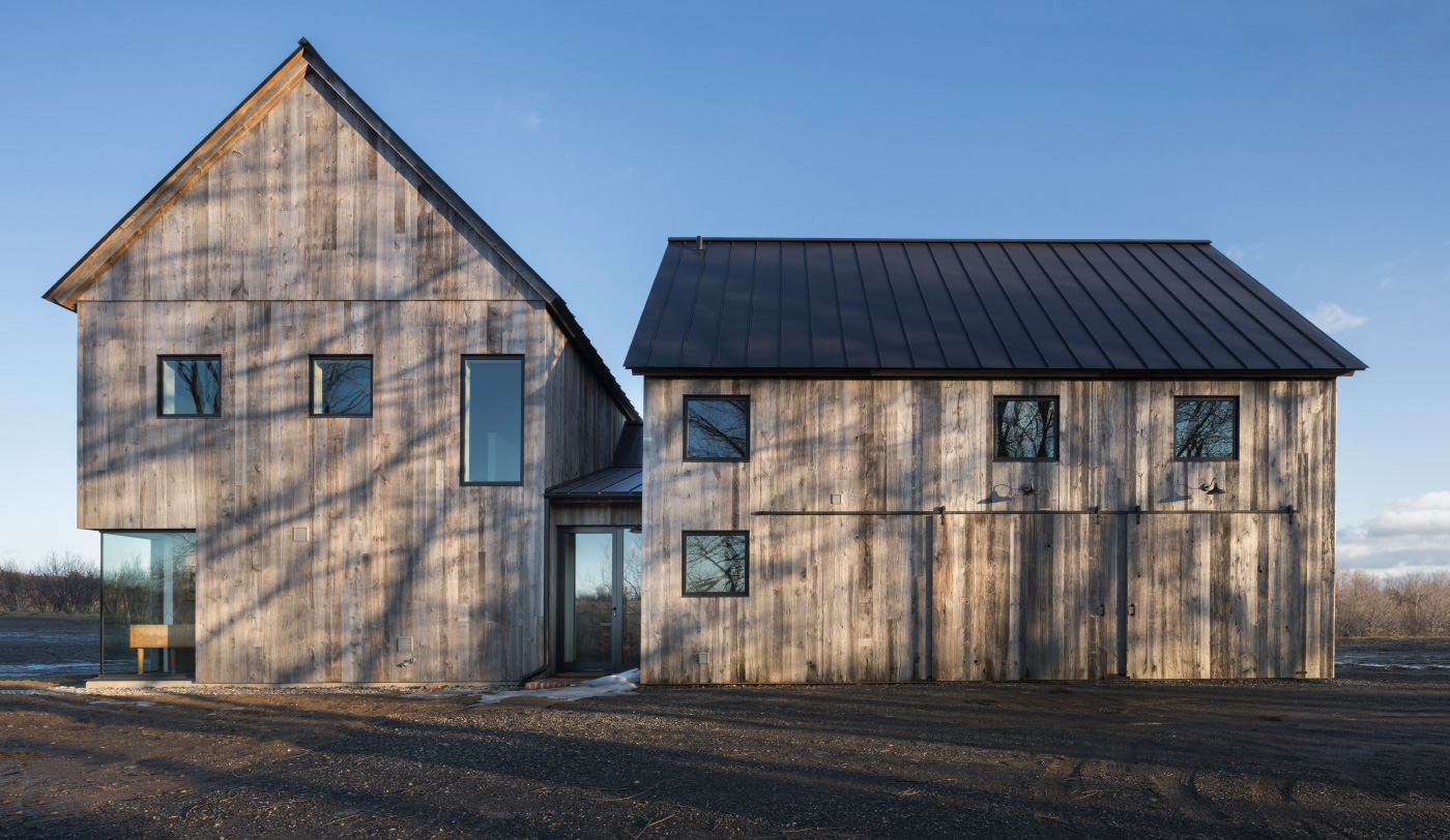 Townships Farmhouse exterior, 2017, in North Hatley, Quebec. (Photography by Stephane Groleau and Laetitia Boudaud/Courtesy LAMAS)